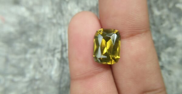 Ceylon Natural Melichrysos Weight : 6.85Cts Dimension : 12.1mm x 9.1mm x 5.9mm Colour : Greenish Yellow Treatment : Unheated/ Natural Clarity : Clean Mineral : Ratnapura Sri Lanka