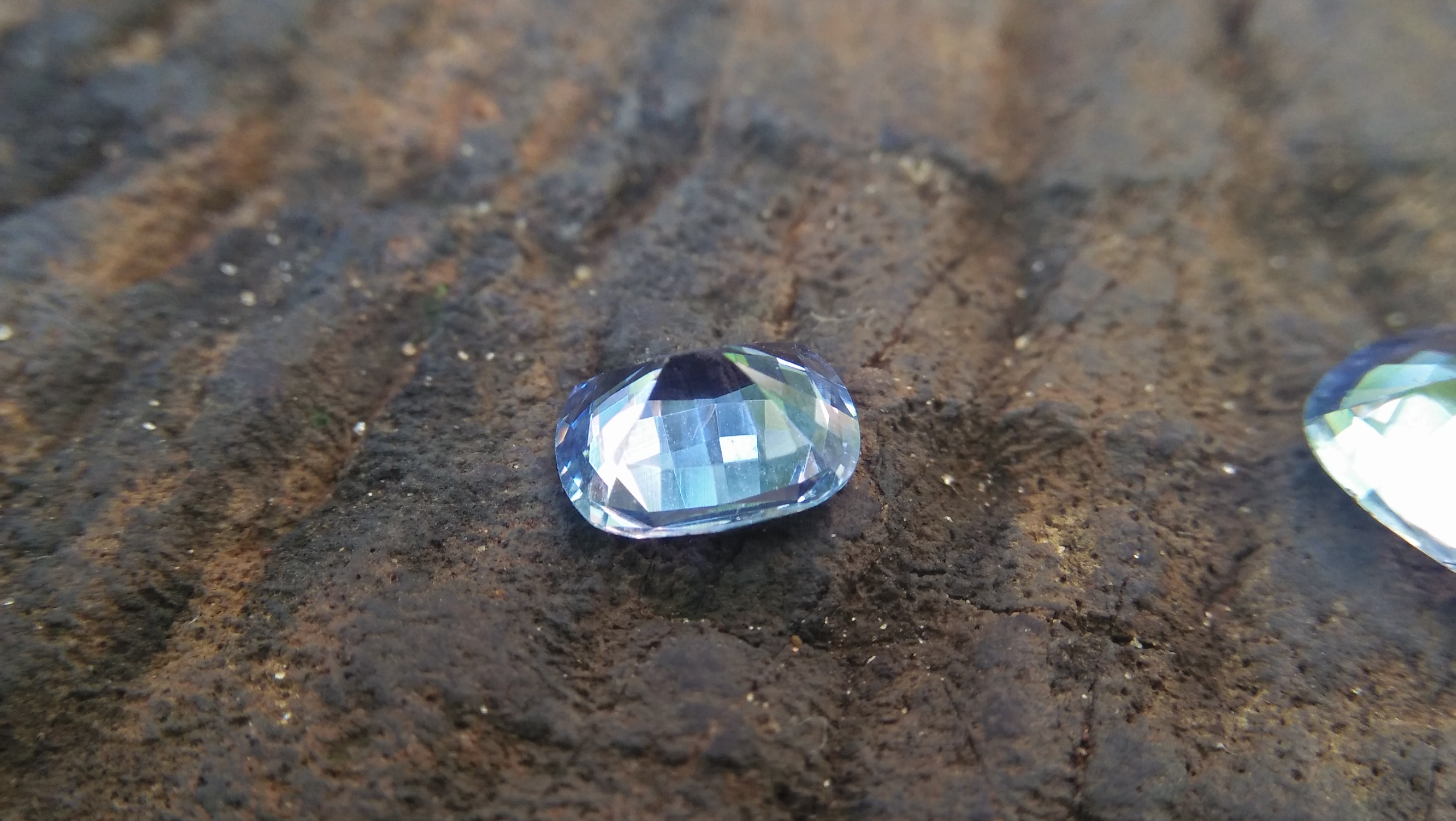 NATURAL BLUEISH WHITE SAPPHIRE Shape : Cution Dimension : 7.2mm x 6mm x 3.5mm Weight : 1.35cts Clarity : Clean Colour : Blueish white Transparency : Transparent Origin : Sri Lanka Treatment : Unheated/ Natural
