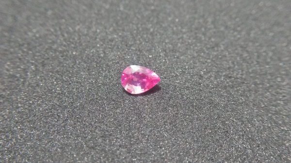 CEYLON NATURAL PINK SAPPHIRE Weight : 1.03Cts Dimension : 6.9 mm x 5.0 mm x 3.8 mm Color: Pink Treatment: Unheated Transparent: Good Transparency Shape : Pear Clarity : Vs COLORED STONE LABORATORY CERTIFIED ( GIA Alumni Association Member) CSL Memo No : 492F1E3C8C3B Sapphire is a precious gemstone, a variety of the mineral corundum, consisting of aluminum oxide with trace amounts of elements such as iron, titanium, chromium, copper, or magnesium. Sapphire deposits are found in Eastern Australia, Thailand, Sri Lanka, China, Vietnam, Madagascar, Greenland, East Africa, and in North America in mostly in Montana. Madagascar, Sri Lanka, and Kashmir produce large quantities of fine quality Sapphires for the world market. Sapphires are mined from alluvial deposits or from primary underground workings.   Blue Sapphire and Ruby are the most popular Gemstone in Corundum Family. also, Orangy Pink Sapphire is called Padparadscha. The name Drive's from the Sinhalese word "padmaraga" " පද්මරාග", meaning lotus blossom, as the stone is of a similar color to the lotus blossom. Bi-Color Sapphire from DanuGroup Collection Also, Sapphire can be found as parti-color, bi-color or fancy color. Australia is a main parti-color Sapphire producer. White Sapphire also, White sapphire is a very popular stone to wear instead of Diamond as a 3rd hardness gemstone after diamond ( moissanite hardness is 9.5). Various colors of star sapphires A star sapphire is a type of sapphire that exhibits a star-like phenomenon known as asterism. Also, A rare variety of natural sapphire, known as color-change sapphire, exhibits different colors in a different light. Sapphires can be treated by several methods to enhance and improve their clarity and color. A common method is done by heating the sapphires in furnaces to temperatures between 500 and 1,850 °C for several hours, or by heating in a nitrogen-deficient atmosphere oven for 1 week or more. Geuda is a form of the mineral corundum. Geuda is found primarily in Sri Lanka. It's a semitransparent and milky appearance due to rutile inclusions. Geuda is used to improve its color by heat treatment. Some geuda varieties turn to a blue color after heat treatments and some turn to red after oxidizing. Also, Kowangu pushparaga turns to yellow sapphire after oxidizing. Sapphire Crystal system is a Trigonal crystal system with a hexagonal scalenohedral crystal class. Sapphire hardness is 9 according to the Mohs hardness scale with 4.0~4.1 specific gravity. Refractive index ω          =1.768–1.772 nε =1.760–1.763 Solubility = Insoluble Melting point = 2,030–2,050 °C Birefringence  = 0.008 Pleochroism = Strong Luster = Vitreous Sapphire is the birthstone for September and the gem of the 45th anniversary. Healing Properties of Sapphire Sapphire releases mental tension, depression, unwanted thoughts, and spiritual confusion.  Sapphire is known as a "stone of Wisdom". It is exceptional for calming and focusing the mind, allowing the release of mental tension and unwanted thoughts. Sapphire is also the best stone for awakening chakras. Dark Blue or Indigo Sapphire stimulates the Third Eye chakra. Blue Sapphire stimulates the Throat Chakra. Green sapphire stimulates Heart Chakra. Black Sapphire stimulates Base Chakra. White sapphire stimulates Crown Chakra. Yellow sapphire stimulates Solar Plexus Chakra. Pink Sapphire Healings It is believed that pink sapphires used for therapeutic purposes as crystals might nourish the emotional well-being of the person wearing the jewelry crafted from the gems. The theory behind these therapeutic beliefs centers on clearing emotional blockages from the past to release hurtful experiences. • Nourishing the Emotional Body with the PinkColor Ray • Energetic Columns of Support • Longevity and Extending the Lifespan of Your Cells • Astral Vision and Sensitivity to Energy