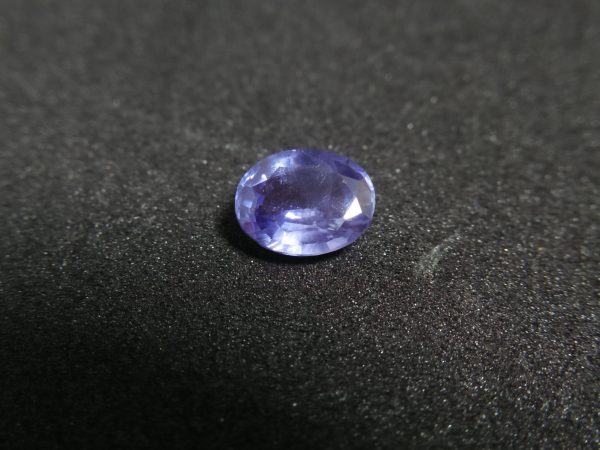 Ceylon Natural Blue Sapphire Colour : Blue Shape : Oval Weight : 1.65 ct Dimension : 7.7mm x 6.2mm x 3.8 mm Treatment : Unheated/ Natural • CSL - Colored Stone Laboratory Certified ( GIA Alumni Association Member ) • CSL Memo No : 6DC22456E105 Sapphire is a precious gemstone, a variety of the mineral corundum, consisting of aluminum oxide with trace amounts of elements such as iron, titanium, chromium, copper, or magnesium. Sapphire deposits are found in Eastern Australia, Thailand, Sri Lanka, China, Vietnam, Madagascar, Greenland, East Africa, and in North America in mostly in Montana. Madagascar, Sri Lanka, and Kashmir produce large quantities of fine quality Sapphires for the world market. Sapphires are mined from alluvial deposits or from primary underground workings. Blue Sapphire and Ruby are the most popular Gemstone in Corundum Family. also, Orangy Pink Sapphire is called Padparadscha. The name Drive's from the Sinhalese word "padmaraga" " පද්මරාග", meaning lotus blossom, as the stone is of a similar color to the lotus blossom. Bi-Color Sapphire from DanuGroup Collection Also, Sapphire can be found as parti-color, bi-color or fancy color. Australia is a main parti-color Sapphire producer. White Sapphire also, White sapphire is a very popular stone to wear instead of Diamond as a 3rd hardness gemstone after diamond ( moissanite hardness is 9.5). Various colors of star sapphires A star sapphire is a type of sapphire that exhibits a star-like phenomenon known as asterism. Also, A rare variety of natural sapphire, known as color-change sapphire, exhibits different colors in a different light. Sapphires can be treated by several methods to enhance and improve their clarity and color. A common method is done by heating the sapphires in furnaces to temperatures between 500 and 1,850 °C for several hours, or by heating in a nitrogen-deficient atmosphere oven for 1 week or more. Geuda is a form of the mineral corundum. Geuda is found primarily in Sri Lanka. It's a semitransparent and milky appearance due to rutile inclusions. Geuda is used to improve its color by heat treatment. Some geuda varieties turn to a blue color after heat treatments and some turn to red after oxidizing. Also, Kowangu pushparaga turns to yellow sapphire after oxidizing. Sapphire Crystal system is a Trigonal crystal system with a hexagonal scalenohedral crystal class. Sapphire hardness is 9 according to the Mohs hardness scale with 4.0~4.1 specific gravity. Refractive index ω          =1.768–1.772 nε =1.760–1.763 Solubility = Insoluble Melting point = 2,030–2,050 °C Birefringence  = 0.008 Pleochroism = Strong Luster = Vitreous Sapphire is the birthstone for September and the gem of the 45th anniversary. Healing Properties of Sapphire Sapphire releases mental tension, depression, unwanted thoughts, and spiritual confusion.  Sapphire is known as a "stone of Wisdom". It is exceptional for calming and focusing the mind, allowing the release of mental tension and unwanted thoughts. Sapphire is also the best stone for awakening chakras. Dark Blue or Indigo Sapphire stimulates the Third Eye chakra. Blue Sapphire stimulates the Throat Chakra. Green sapphire stimulates Heart Chakra. Black Sapphire stimulates Base Chakra. White sapphire stimulates Crown Chakra. Yellow sapphire stimulates Solar Plexus Chakra. Blue Sapphire stimulates the Throat Chakra and Third eye chakra, the voice of the body. Blue crystal energy will unblock and balance the Throat Chakra. blue encourages the power of truth, while lighter shades carry the power of flexibility, relaxation, and balance. Blue Sapphire can free one of mental anxiety, helps make one detached, and protects against envy. Also, It can be worn for good luck and for protection against evil spirits. Since Saturn rules the nervous system, blue sapphires help problems of the nerves-tension and neuroses-diseases caused by an afflicted Saturn.