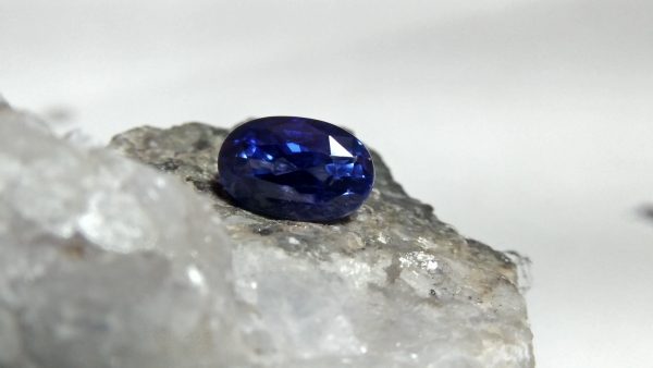 NATURAL BLUE SAPPHIRE "Cornflower Blue" Colour : Blue "Cornflower Blue" Shape : Oval Weight : 3.03 CTS Dimension : 9.5 x 6.7 x 5.4 mm Treatment : Heated Clarity : SI • CSL - Colored Stone Laboratory Certified ( GIA Alumni Association Member ) • CSL Memo No : 55ED5237BF86 Sapphire is a precious gemstone, a variety of the mineral corundum, consisting of aluminum oxide with trace amounts of elements such as iron, titanium, chromium, copper, or magnesium. Sapphire deposits are found in Eastern Australia, Thailand, Sri Lanka, China, Vietnam, Madagascar, Greenland, East Africa, and in North America in mostly in Montana. Madagascar, Sri Lanka, and Kashmir produce large quantities of fine quality Sapphires for the world market. Sapphires are mined from alluvial deposits or from primary underground workings. Blue Sapphire and Ruby are the most popular Gemstone in Corundum Family. also, Orangy Pink Sapphire is called Padparadscha. The name Drive's from the Sinhalese word "padmaraga" " පද්මරාග", meaning lotus blossom, as the stone is of a similar color to the lotus blossom. Bi-Color Sapphire from DanuGroup Collection Also, Sapphire can be found as parti-color, bi-color or fancy color. Australia is a main parti-color Sapphire producer. White Sapphire also, White sapphire is a very popular stone to wear instead of Diamond as a 3rd hardness gemstone after diamond ( moissanite hardness is 9.5). Various colors of star sapphires A star sapphire is a type of sapphire that exhibits a star-like phenomenon known as asterism. Also, A rare variety of natural sapphire, known as color-change sapphire, exhibits different colors in a different light. Sapphires can be treated by several methods to enhance and improve their clarity and color. A common method is done by heating the sapphires in furnaces to temperatures between 500 and 1,850 °C for several hours, or by heating in a nitrogen-deficient atmosphere oven for 1 week or more. Geuda is a form of the mineral corundum. Geuda is found primarily in Sri Lanka. It's a semitransparent and milky appearance due to rutile inclusions. Geuda is used to improve its color by heat treatment. Some geuda varieties turn to a blue color after heat treatments and some turn to red after oxidizing. Also, Kowangu pushparaga turns to yellow sapphire after oxidizing. Sapphire Crystal system is a Trigonal crystal system with a hexagonal scalenohedral crystal class. Sapphire hardness is 9 according to the Mohs hardness scale with 4.0~4.1 specific gravity. Refractive index ω          =1.768–1.772 nε =1.760–1.763 Solubility = Insoluble Melting point = 2,030–2,050 °C Birefringence  = 0.008 Pleochroism = Strong Luster = Vitreous Sapphire is the birthstone for September and the gem of the 45th anniversary. Healing Properties of Sapphire Sapphire releases mental tension, depression, unwanted thoughts, and spiritual confusion.  Sapphire is known as a "stone of Wisdom". It is exceptional for calming and focusing the mind, allowing the release of mental tension and unwanted thoughts. Sapphire is also the best stone for awakening chakras. Dark Blue or Indigo Sapphire stimulates the Third Eye chakra. Blue Sapphire stimulates the Throat Chakra. Green sapphire stimulates Heart Chakra. Black Sapphire stimulates Base Chakra. White sapphire stimulates Crown Chakra. Yellow sapphire stimulates Solar Plexus Chakra. Blue Sapphire stimulates the Throat Chakra and Third eye chakra, the voice of the body. Blue crystal energy will unblock and balance the Throat Chakra. blue encourages the power of truth, while lighter shades carry the power of flexibility, relaxation, and balance. Blue Sapphire can free one of mental anxiety, helps make one detached, and protects against envy. Also, It can be worn for good luck and for protection against evil spirits. Since Saturn rules the nervous system, blue sapphires help problems of the nerves-tension and neuroses-diseases caused by an afflicted Saturn.