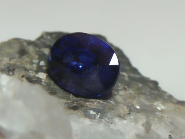 NATURAL BLUE SAPPHIRE Colour : Vivid Blue "Royal Blue" Shape : Oval Weight : 2.16 CTS Dimension : 8.4 x 6.1 x 4.9 mm Treatments : Heated Clarity : SI • CSL - Colored Stone Laboratory Certified ( GIA Alumni Association Member ) • CSL Memo No : E63051265A61 Sapphire is a precious gemstone, a variety of the mineral corundum, consisting of aluminum oxide with trace amounts of elements such as iron, titanium, chromium, copper, or magnesium. Sapphire deposits are found in Eastern Australia, Thailand, Sri Lanka, China, Vietnam, Madagascar, Greenland, East Africa, and in North America in mostly in Montana. Madagascar, Sri Lanka, and Kashmir produce large quantities of fine quality Sapphires for the world market. Sapphires are mined from alluvial deposits or from primary underground workings. Blue Sapphire and Ruby are the most popular Gemstone in Corundum Family. also, Orangy Pink Sapphire is called Padparadscha. The name Drive's from the Sinhalese word "padmaraga" " පද්මරාග", meaning lotus blossom, as the stone is of a similar color to the lotus blossom. Bi-Color Sapphire from DanuGroup Collection Also, Sapphire can be found as parti-color, bi-color or fancy color. Australia is a main parti-color Sapphire producer. White Sapphire also, White sapphire is a very popular stone to wear instead of Diamond as a 3rd hardness gemstone after diamond ( moissanite hardness is 9.5). Various colors of star sapphires A star sapphire is a type of sapphire that exhibits a star-like phenomenon known as asterism. Also, A rare variety of natural sapphire, known as color-change sapphire, exhibits different colors in a different light. Sapphires can be treated by several methods to enhance and improve their clarity and color. A common method is done by heating the sapphires in furnaces to temperatures between 500 and 1,850 °C for several hours, or by heating in a nitrogen-deficient atmosphere oven for 1 week or more. Geuda is a form of the mineral corundum. Geuda is found primarily in Sri Lanka. It's a semitransparent and milky appearance due to rutile inclusions. Geuda is used to improve its color by heat treatment. Some geuda varieties turn to a blue color after heat treatments and some turn to red after oxidizing. Also, Kowangu pushparaga turns to yellow sapphire after oxidizing. Sapphire Crystal system is a Trigonal crystal system with a hexagonal scalenohedral crystal class. Sapphire hardness is 9 according to the Mohs hardness scale with 4.0~4.1 specific gravity. Refractive index ω          =1.768–1.772 nε =1.760–1.763 Solubility = Insoluble Melting point = 2,030–2,050 °C Birefringence  = 0.008 Pleochroism = Strong Luster = Vitreous Sapphire is the birthstone for September and the gem of the 45th anniversary. Healing Properties of Sapphire Sapphire releases mental tension, depression, unwanted thoughts, and spiritual confusion.  Sapphire is known as a "stone of Wisdom". It is exceptional for calming and focusing the mind, allowing the release of mental tension and unwanted thoughts. Sapphire is also the best stone for awakening chakras. Dark Blue or Indigo Sapphire stimulates the Third Eye chakra. Blue Sapphire stimulates the Throat Chakra. Green sapphire stimulates Heart Chakra. Black Sapphire stimulates Base Chakra. White sapphire stimulates Crown Chakra. Yellow sapphire stimulates Solar Plexus Chakra. Blue Sapphire stimulates the Throat Chakra and Third eye chakra, the voice of the body. Blue crystal energy will unblock and balance the Throat Chakra. blue encourages the power of truth, while lighter shades carry the power of flexibility, relaxation, and balance. Blue Sapphire can free one of mental anxiety, helps make one detached, and protects against envy. Also, It can be worn for good luck and for protection against evil spirits. Since Saturn rules the nervous system, blue sapphires help problems of the nerves-tension and neuroses-diseases caused by an afflicted Saturn.