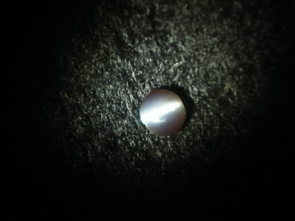 Natural Alexandrite Cats Eye Colour : c.c from Deep Green to deep red Shape : Round Cut : Cabochon Weight : 0.44 Cts Dimension : 4.8 x 4.3 x 2.2 mm Treatment : Unheated