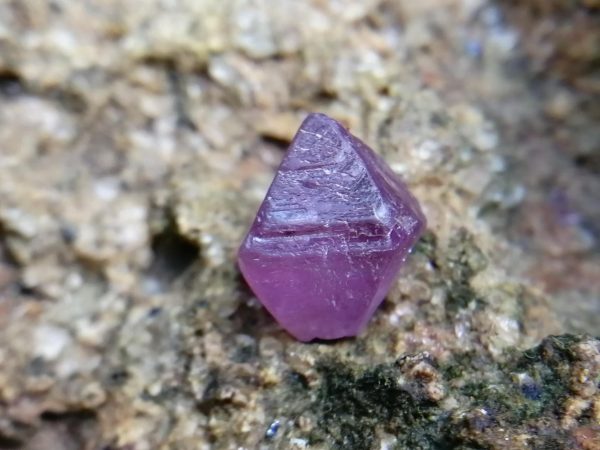 Natural Purplish-Pink Spinel Sri Lanka Spinel is the magnesium-aluminum member of the larger spinel group of minerals with chemical formula MgAl₂O₄. Spinel is actually a large group of minerals. Gahnite, hercynite, ceylonite, picotite, and galaxite are all part of the spinel group. This oxide mineral is a Cubic crystal system with 7.5–8.0 hardness according to the Mohs hardness scale. Spinels Specific Gravity is depending on the composition of chemicals such as Zn-rich spinel can be as high as 4.40, otherwise, it averages from 3.58 to 3.61. Spinel has many colors such as red, pink, blue, lavender/violet, dark green, brown, black, colorless, gray. Spinel is a single reflective Non-pleochroic gemstone and Anomalous in some blue zincian varieties. It can be found as Opaque, Translucent or transparent. Spinel RI value is n = 1.719 Some red and pink spinels have fluorescence under UV Light. also, Some spinels have magnetism Weak to medium. Natural spinels typically are not enhanced. Spinels are found in Madagascar, Sri Lanka, Vietnam, Myanmar, Tanzania, Kenya, Nigeria, Afghanistan, Albania, Algeria, Atlantic Ocean, Australia, Belgium, Bolivia, Brazil, Cambodia, Canada. Spinel has long been found in the gemstone-bearing gravel of Sri Lanka. Since 2000 in several locations around the world have been discovered spinels with unusual vivid colors. when the mineral is pure, it’s colorless. That's called allochromatic gemstones. Als, Spinels are found with 4-rayed stars and 6-rayed stars. Some spinels are found with a color-changing effect such as Blue to violet, Grayish-blue to reddish-violet and some stones from Sri Lanka change from violet to reddish violet, due to the presence of Fe, Cr, and V. Blue Spinel is a very special gemstone because it is one of the few that occur naturally. The blue Spinel is colored from the impurity of Cobalt in the crystal lattice. High Color saturation in blue Spinels are always colored by Cobalt and are extremely rare to find. Cobalt spinel has a high market value. Healing Properties of Spinels 👇 Spinel is known as the stone of revitalization. This MgAl2O4 mineral powers make the gums and teeth stronger and are also beneficial for gums, skin, slimming the healthy and overweight body and cancer healing. Spinel promotes physical vitality, refills the energy and eases exhaustion. Spinel is a very soothing stone, as it calms and relieves stress, anxiety, PTSD and depression. Also, Spinel is working with chakra balancing. Blue Spinel stimulates throat chakra and help to user stay in spiritual path. Descriptions Colour : Purplish-Pink Shape : Prismatic Cubic Weight : 2.60 Cts Dimension : 7.9 x 8 x 8.5 mm Treatment : Unheated Clarity : I 粉色尖晶石 重量 : 2.60 卡拉 尺寸 : 7.9 x 8 x 8.5 mm 颜色 : 粉色 透明 : 好透明 形状 : 棱柱立方 清晰度 : I 治疗：没有加热