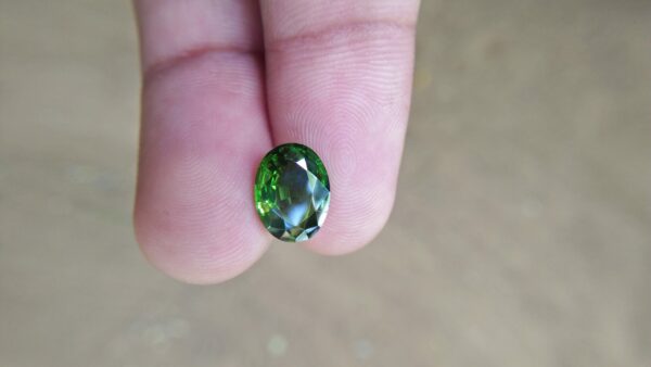 Zircon is a mineral belonging to the group of nesosilicates. Its chemical name is zirconium silicate, and its corresponding chemical formula is ZrSiO₄. Green colour Zircons are rare colour veriety of zircon family. Zircon has an anti-spasmodic effect on the liver and gall bladder of the wearer. Green Zircon helps one open up to make new friends and draws wealth