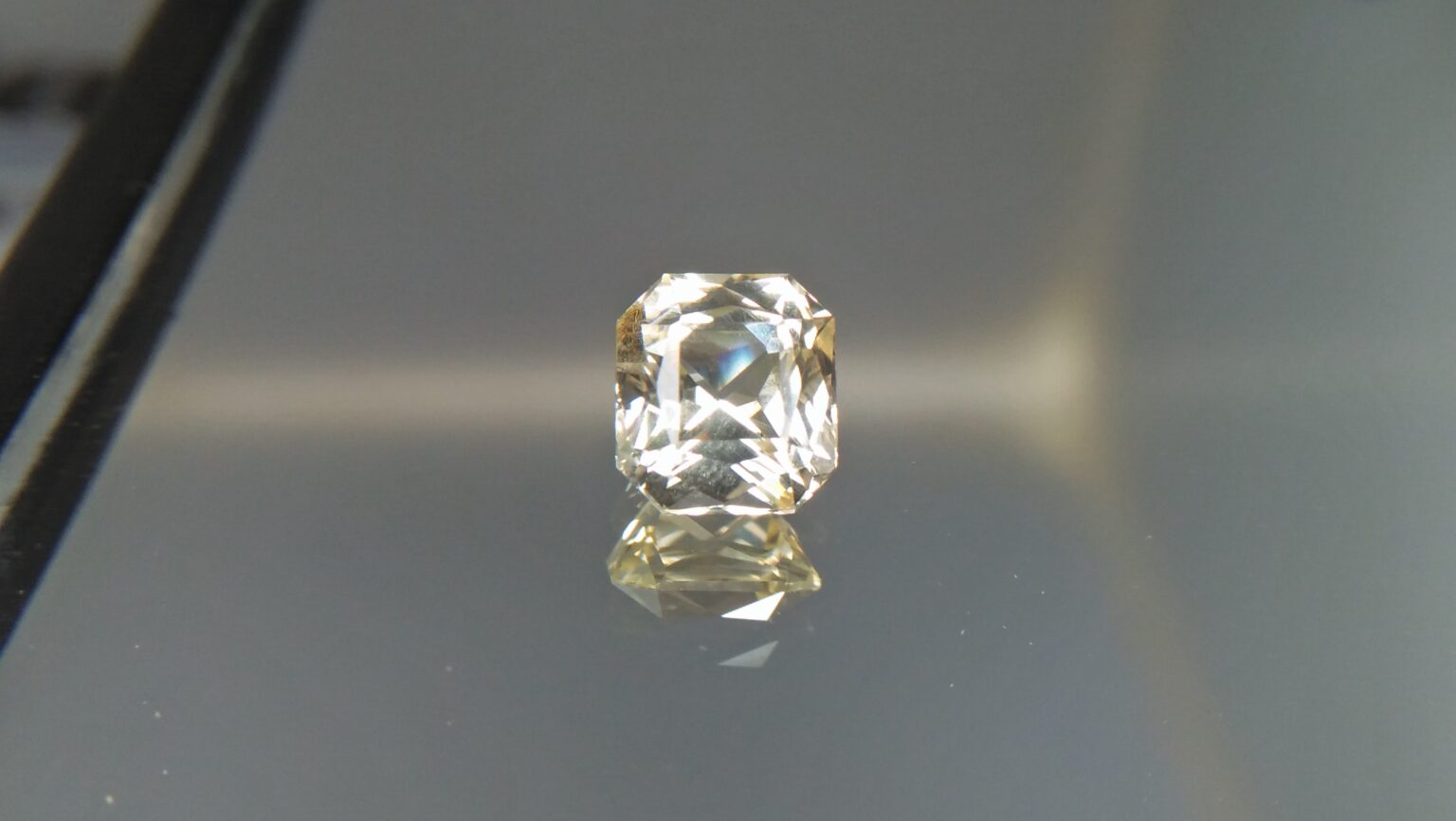 Ceylon Natural Mild Lemon Sapphire ( Yellow) Sapphire Dimension : 6.1mm x 5.6mm x 4.1mm Weight : 1.35 Cts Shape/Cut : Asscher Colour : Mild Lomon Jin Colour Treatment : Unheated / Natural Mineral : Ratnapura, Sri Lanka Clarity : VVS