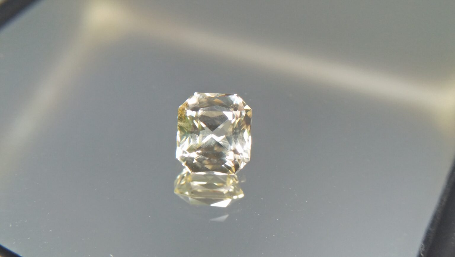 Ceylon Natural Mild Lemon Sapphire ( Yellow) Sapphire Dimension : 6.1mm x 5.6mm x 4.1mm Weight : 1.35 Cts Shape/Cut : Asscher Colour : Mild Lomon Jin Colour Treatment : Unheated / Natural Mineral : Ratnapura, Sri Lanka Clarity : VVS