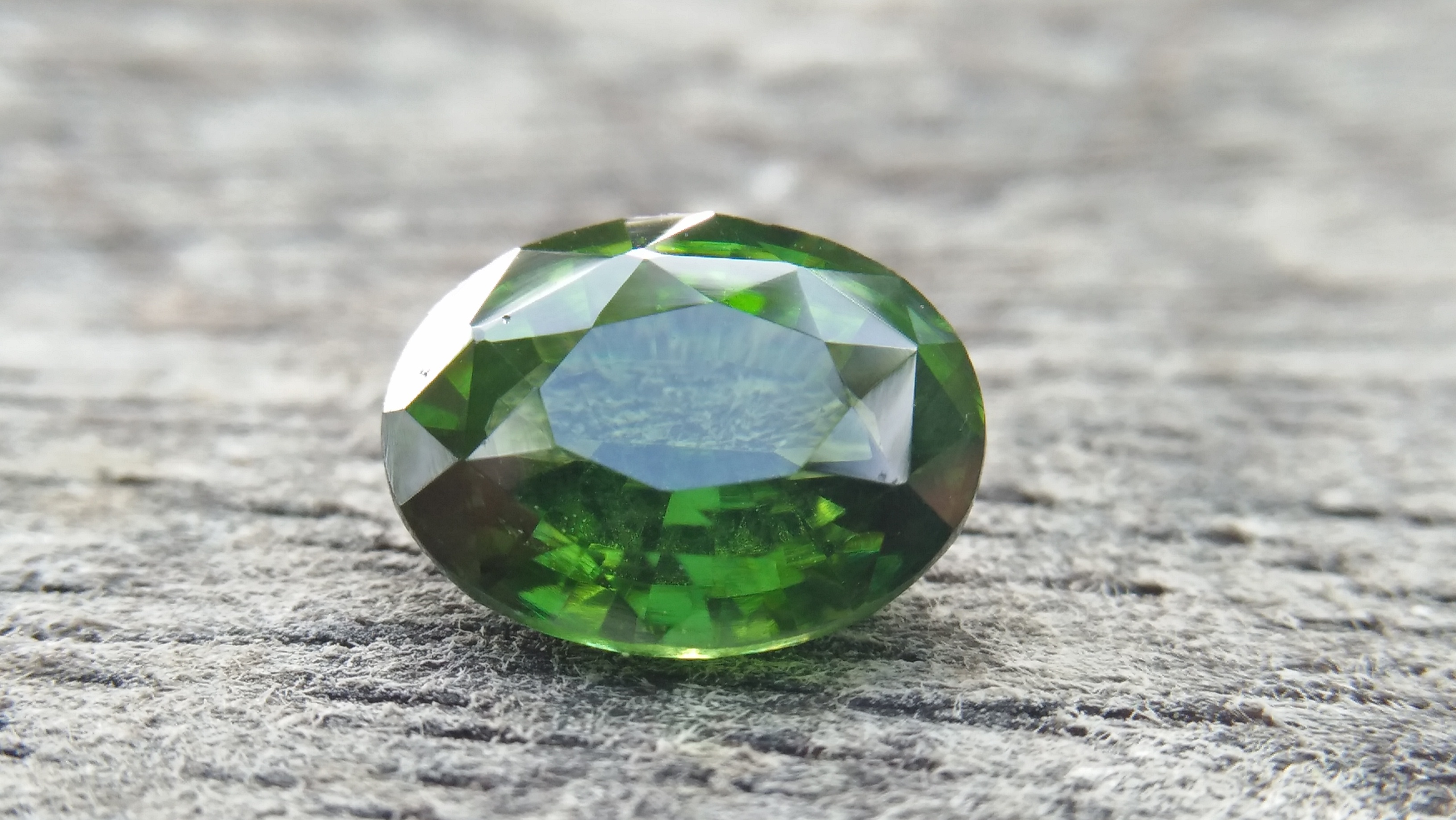 Zircon is a mineral belonging to the group of nesosilicates. Its chemical name is zirconium silicate, and its corresponding chemical formula is ZrSiO₄. Green colour Zircons are rare colour veriety of zircon family. Zircon has an anti-spasmodic effect on the liver and gall bladder of the wearer. Green Zircon helps one open up to make new friends and draws wealth