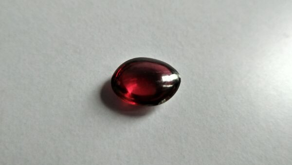 Ceylon Natural Rhodolite Garnet Cabochon Eye 👀 Weight: 2.05Cts Dimension: 9.1mm x 6.9mm x 3.5mm Mineral: Ratapura, Sri Lanka Clarity: Very Clean Colour: Pinkish Red Birthstone: June birthstone Rhodolite is a varietal name for rose-pink to red mineral pyrope, a species in the garnet group Mohs scale hardness: 7–7.5 Refractive index: 1.760