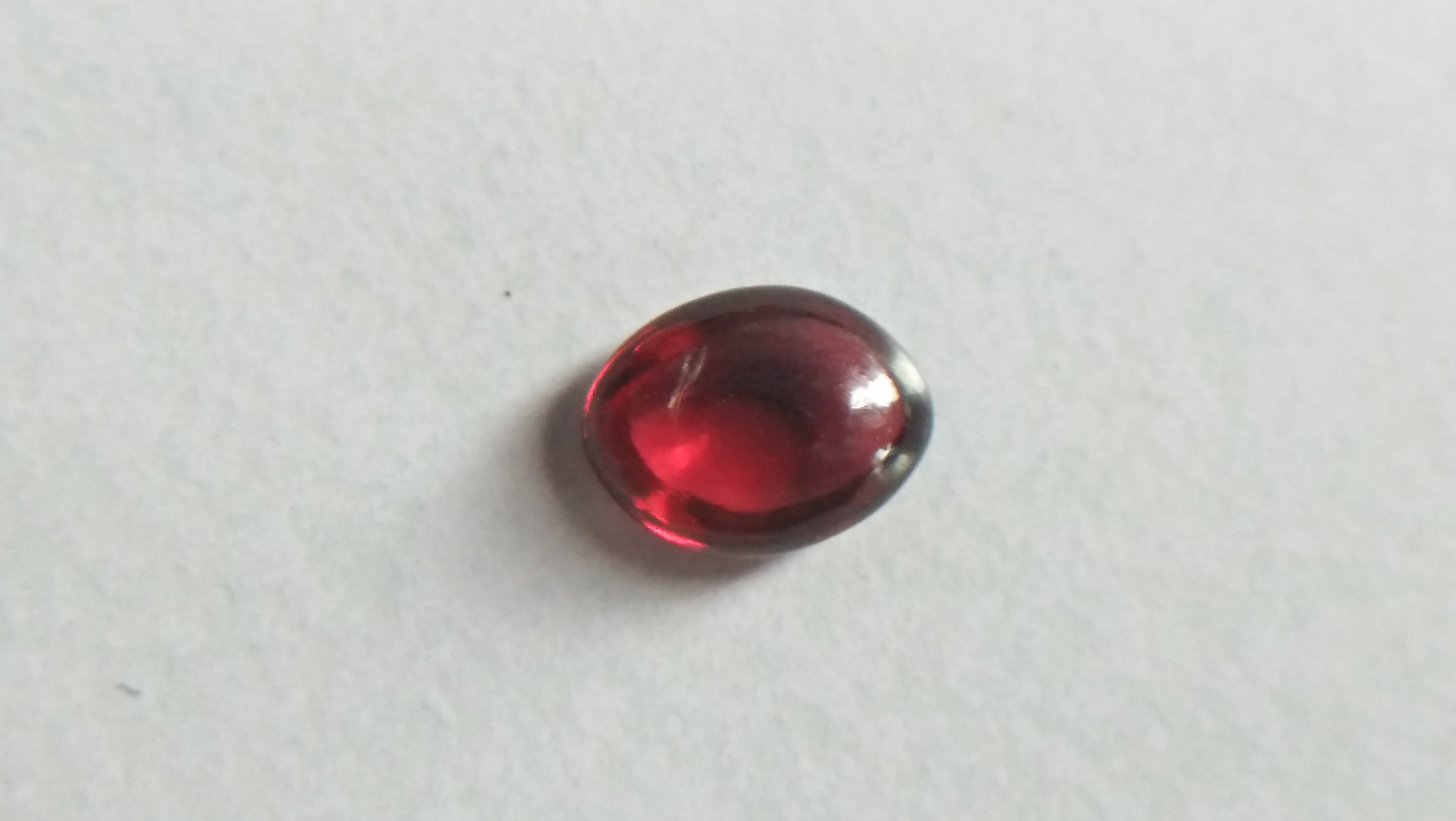 Ceylon Natural Rhodolite Garnet Cabochon Eye 👀 Weight: 2.05Cts Dimension: 9.1mm x 6.9mm x 3.5mm Mineral: Ratapura, Sri Lanka Clarity: Very Clean Colour: Pinkish Red Birthstone: June birthstone Rhodolite is a varietal name for rose-pink to red mineral pyrope, a species in the garnet group Mohs scale hardness: 7–7.5 Refractive index: 1.760