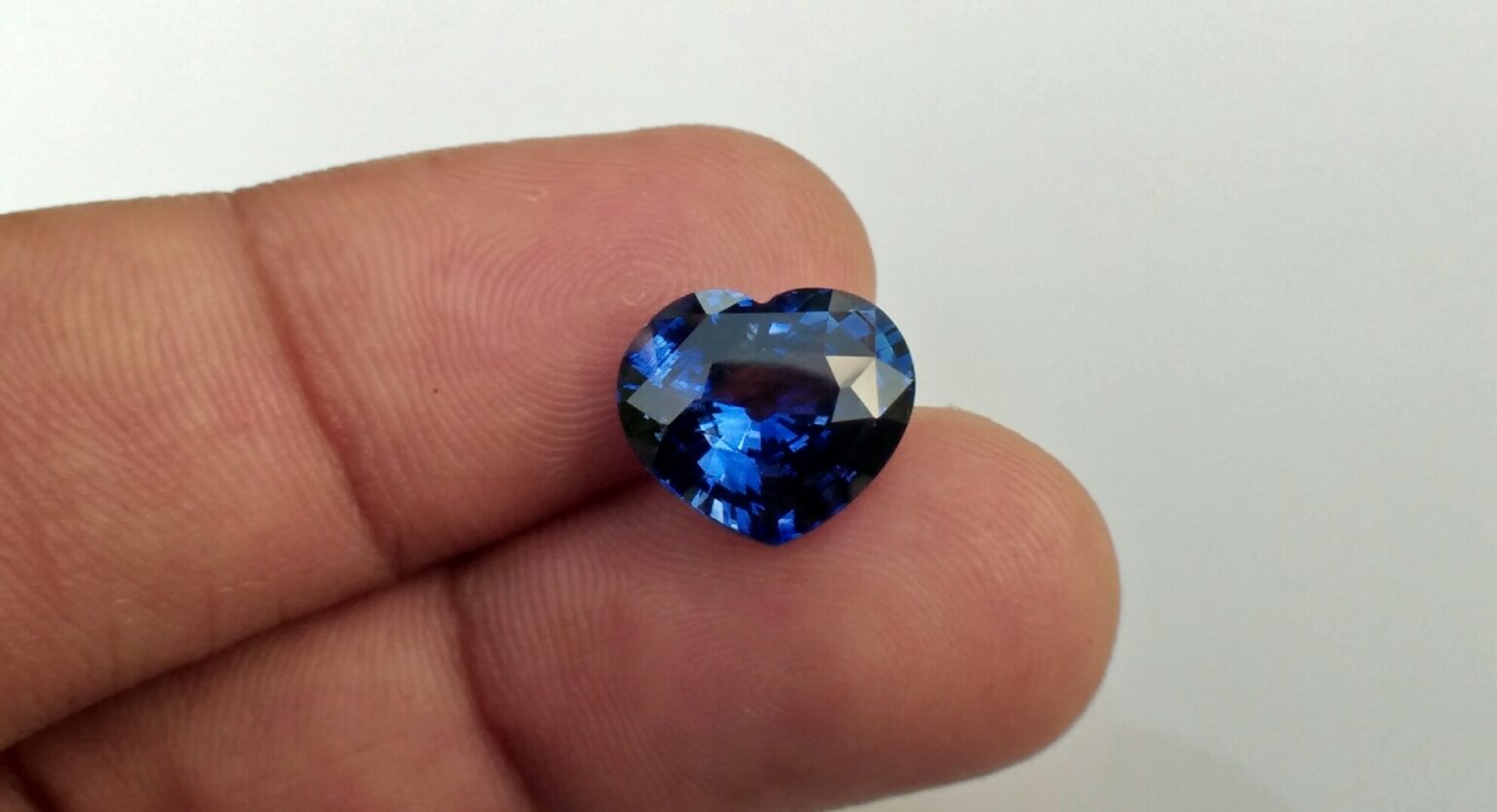 Ceylon Natural Blue Sapphire  Dimension : 9.8mm x 11.3mm x 5.9mm Weight : 5.15Cts Locality : Ratnapura, Sri Lanka Shape : Heart Sapphire is a precious gemstone, a variety of the mineral corundum, consisting of aluminium oxide with trace amounts of elements such as iron, titanium, chromium, copper, or magnesium. Sapphire helps the user stay on the Spiritual Path, boosting psychic and spiritual powers, and is a great stone for Earth and Chakra healing. also, all corundums share some energies in common, the various colours of Sapphire have individual vibrational signatures and different spiritual properties. Sapphire was used by the Etruscans over 2,500 years ago and was also prized in ancient Rome, Greece and Egypt. Revered as a stone of royalty, sapphire was believed to keep kings safe from harm or envy. Blue Sapphire stimulates the Throat Chakra, the voice of the body. Blue crystal energy will unblock and balance the Throat Chakra. blue encourage the power of truth, while lighter shades carry the power of flexibility, relaxation, and balance. Blue Sapphire can free one of mental anxiety, helps make one detached, and protects against envy. Also, It can be worn for good luck and for protection against evil spirits. Since Saturn rules the nervous system, blue sapphires help problems of the nerves-tension and neuroses-diseases caused by an afflicted Saturn.