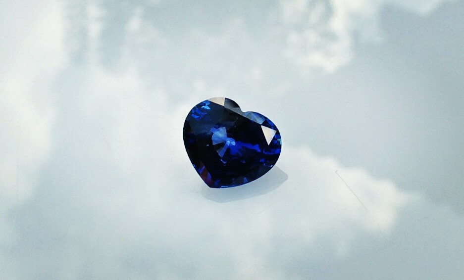 Ceylon Natural Blue Sapphire  Dimension : 9.8mm x 11.3mm x 5.9mm Weight : 5.15Cts Locality : Ratnapura, Sri Lanka Shape : Heart Sapphire is a precious gemstone, a variety of the mineral corundum, consisting of aluminium oxide with trace amounts of elements such as iron, titanium, chromium, copper, or magnesium. Sapphire helps the user stay on the Spiritual Path, boosting psychic and spiritual powers, and is a great stone for Earth and Chakra healing. also, all corundums share some energies in common, the various colours of Sapphire have individual vibrational signatures and different spiritual properties. Sapphire was used by the Etruscans over 2,500 years ago and was also prized in ancient Rome, Greece and Egypt. Revered as a stone of royalty, sapphire was believed to keep kings safe from harm or envy. Blue Sapphire stimulates the Throat Chakra, the voice of the body. Blue crystal energy will unblock and balance the Throat Chakra. blue encourage the power of truth, while lighter shades carry the power of flexibility, relaxation, and balance. Blue Sapphire can free one of mental anxiety, helps make one detached, and protects against envy. Also, It can be worn for good luck and for protection against evil spirits. Since Saturn rules the nervous system, blue sapphires help problems of the nerves-tension and neuroses-diseases caused by an afflicted Saturn.