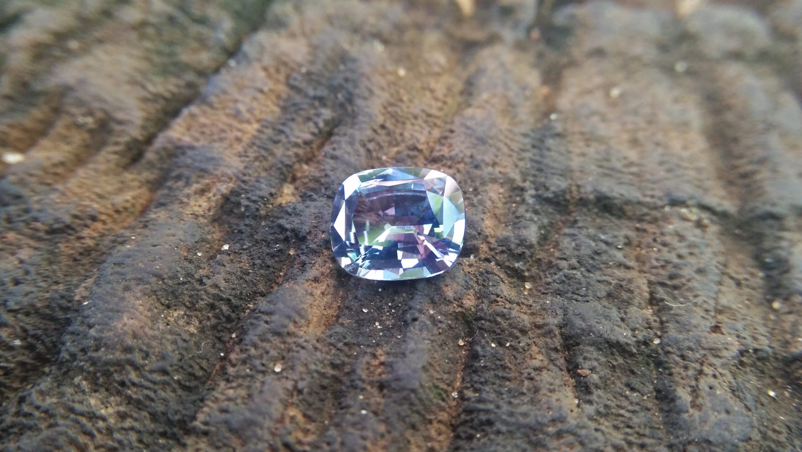NATURAL BLUEISH WHITE SAPPHIRE Shape : Cution Dimension : 7.2mm x 6mm x 3.5mm Weight : 1.35cts Clarity : Clean Colour : Blueish white Transparency : Transparent Origin : Sri Lanka Treatment : Unheated/ Natural