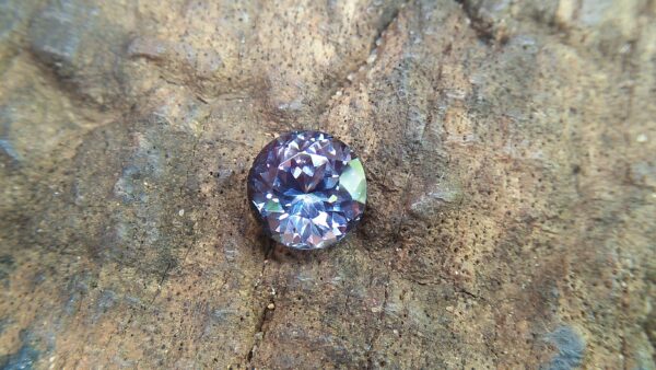 Natural Violetish Gray Spinel Shape : Round Cut : Round Flower Cut Clarity : SI Treatment : Natural/Unheated Dimension : 7.25 mm x 5.3 mm Weight : 2.05Cts Location : City of Gem Ratnapura Sri Lanka