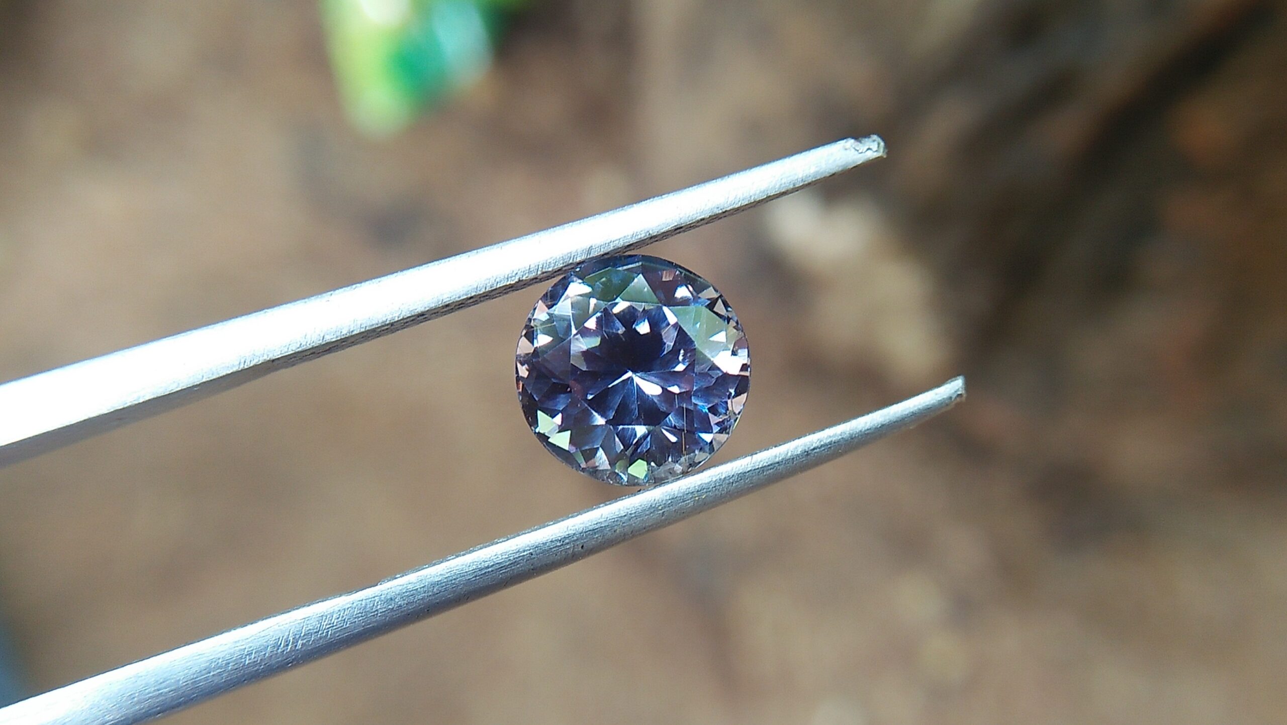 Natural Violetish Gray Spinel Shape : Round Cut : Round Flower Cut Clarity : SI Treatment : Natural/Unheated Dimension : 7.25 mm x 5.3 mm Weight : 2.05Cts Location : City of Gem Ratnapura Sri Lanka