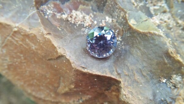Natural Violetish Gray Spinel Shape : Round Cut : Round Flower Cut Clarity : SI Treatment : Natural/Unheated Dimension : 7.25 mm x 5.3 mm Weight : 2.05Cts Location : City of Gem Ratnapura Sri Lanka