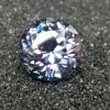 Natural Violetish Gray Spinel Shape : Round Cut : Round Flower Cut Clarity : SI Treatment : Natural/Unheated Dimension : 7.25 mm x 5.3 mm Weight : 2.05Cts Location : City of Gem Ratnapura Sri Lanka