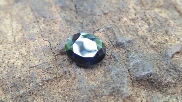 Natural Dark Blue Sapphire ( Kakanil ) කාකනිල් සෙනසුරු ග්‍රහයාට අයත් මැණික Stone of Saturn Shape : Ovel Clarity : Clean Treatment : Natural/Unheated Dimension : 5.9mm x 4.8mm x 3.3mm Weight : 0.79Cts Location : City of Gem Ratnapura Sri Lanka