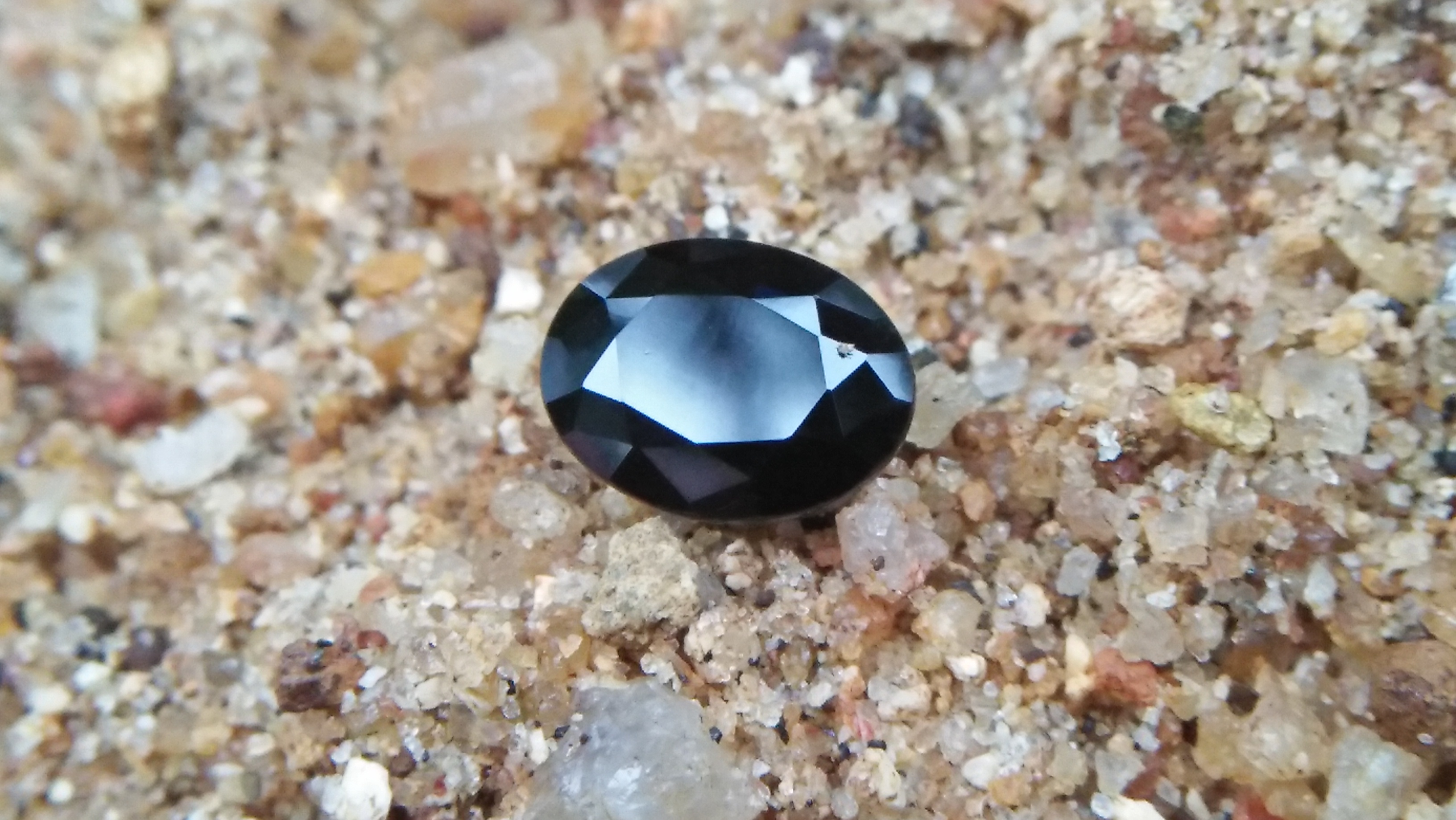 Natural Dark Blue Sapphire ( Kakanil ) කාකනිල් සෙනසුරු ග්‍රහයාට අයත් මැණික/ Stone of Saturn Shape : Ovel Clarity : Clean Treatment : Natural/Unheated Dimension : 7.3mmx 5.3mm x 3.9mm Weight : 1.55Cts Location : City of Gem Ratnapura Sri Lanka