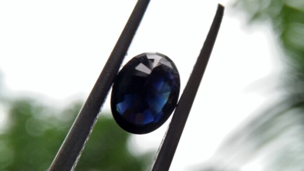 Natural Dark Blue Sapphire ( Kakanil ) කාකනිල් සෙනසුරු ග්‍රහයාට අයත් මැණික/ Stone of Saturn Shape : Ovel Clarity : Clean Treatment : Natural/Unheated Dimension : 7.3mmx 5.3mm x 3.9mm Weight : 1.55Cts Location : City of Gem Ratnapura Sri Lanka