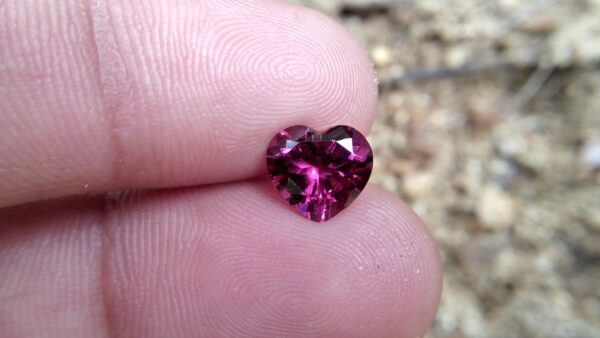 Natural Colour Change Rhodolite Garnet Weight : 2.10Cts Dimension: 7.6 mm x 8.3mm x 4.7 mm Colour: changing colors Red to purplish pink Clarity : Clean Shape : Heart Birthstone : January Treatment : Unheated/Natural
