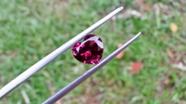 Natural Colour Change Rhodolite Garnet Weight : 2.10Cts Dimension: 7.6 mm x 8.3mm x 4.7 mm Colour: changing colors Red to purplish pink Clarity : Clean Shape : Heart Birthstone : January Treatment : Unheated/Natural