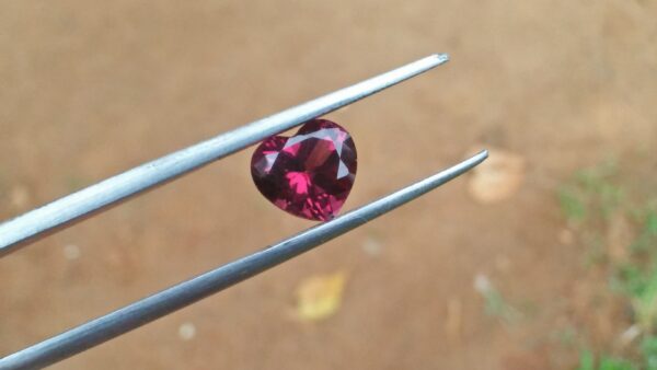 Natural Colour Change Rhodolite Garnet Weight : 2.10Cts Dimension: 7.6 mm x 8.3mm x 4.7 mm Colour: changing colors Red to purplish pink Clarity : Clean Shape : Heart Birthstone : January Treatment : Unheated/Natural