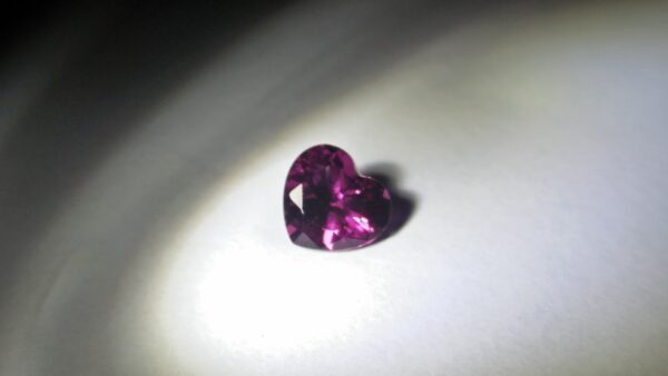 Natural Colour Change Rhodolite Garnet Weight : 2.10Cts Dimension: 7.6 mm x 8.3mm x 4.7 mm Colour: changing colors Red to purplish pink Clarity : Clean Shape : Heart Birthstone : January Treatment : Unheated/Natural