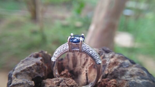Natural Blue Spinel Standard 925 Silver Ring Stone : Natuarl Blue Sapinel Shape : Round Brilliant Cut ( Diamond Cut) Clarity : Clean Treatment : Natural/Unheated Dimension : 6.1 mm x 3.1mm Mineral : City of gem Ratnapura Sri Lanka Metal : Standard 925 Silver Other : Also, We attached 24 AD's (American Diamond) to get more luster & More Beauty.