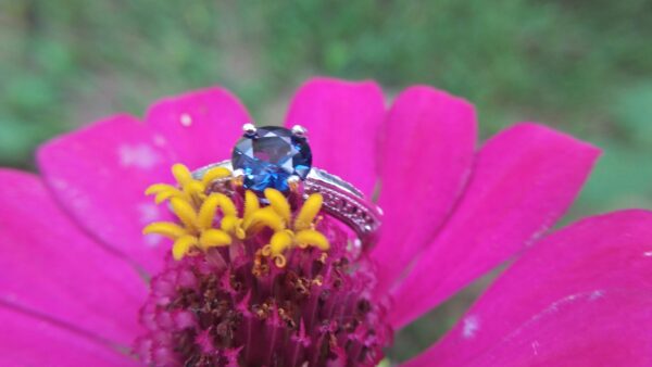 Natural Blue Spinel Standard 925 Silver Ring Stone : Natuarl Blue Sapinel Shape : Round Brilliant Cut ( Diamond Cut) Clarity : Clean Treatment : Natural/Unheated Dimension : 6.1 mm x 3.1mm Mineral : City of gem Ratnapura Sri Lanka Metal : Standard 925 Silver Other : Also, We attached 24 AD's (American Diamond) to get more luster & More Beauty.