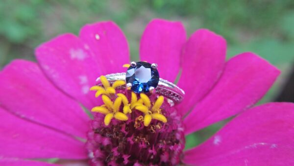 Natural Blue Spinel Standard 925 Silver Ring Stone : Natuarl Blue Sapinel Shape : Round Brilliant Cut ( Diamond Cut) Clarity : Clean Treatment : Natural/Unheated Dimension : 6.1 mm x 3.1mm Mineral : City of gem Ratnapura Sri Lanka Metal : Standard 925 Silver Other : Also, We attached 24 AD's (American Diamond) to get more luster & More Beauty.