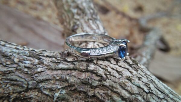Natural Blue Spinel Standard 925 Silver Ring Stone : Natuarl Blue Sapinel Shape : Round Brilliant Cut ( Diamond Cut) Clarity : Clean Treatment : Natural/Unheated Dimension : 6.1 mm x 3.1mm Mineral : City of gem Ratnapura Sri Lanka Metal : Standard 925 Silver Other : Also, We attached 24 AD's (American Diamond) to get more luster & More Beauty.