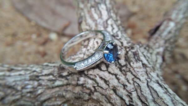 Natural Blue Spinel Standard 925 Silver Ring Stone : Natuarl Blue Sapinel Shape : Round Brilliant Cut ( Diamond Cut) Clarity : Clean Treatment : Natural/Unheated Dimension : 6.1 mm x 3.1mm Mineral : City of gem Ratnapura Sri Lanka Metal : Standard 925 Silver Other : Also, We attached 24 AD's (American Diamond) to get more luster & More Beauty.