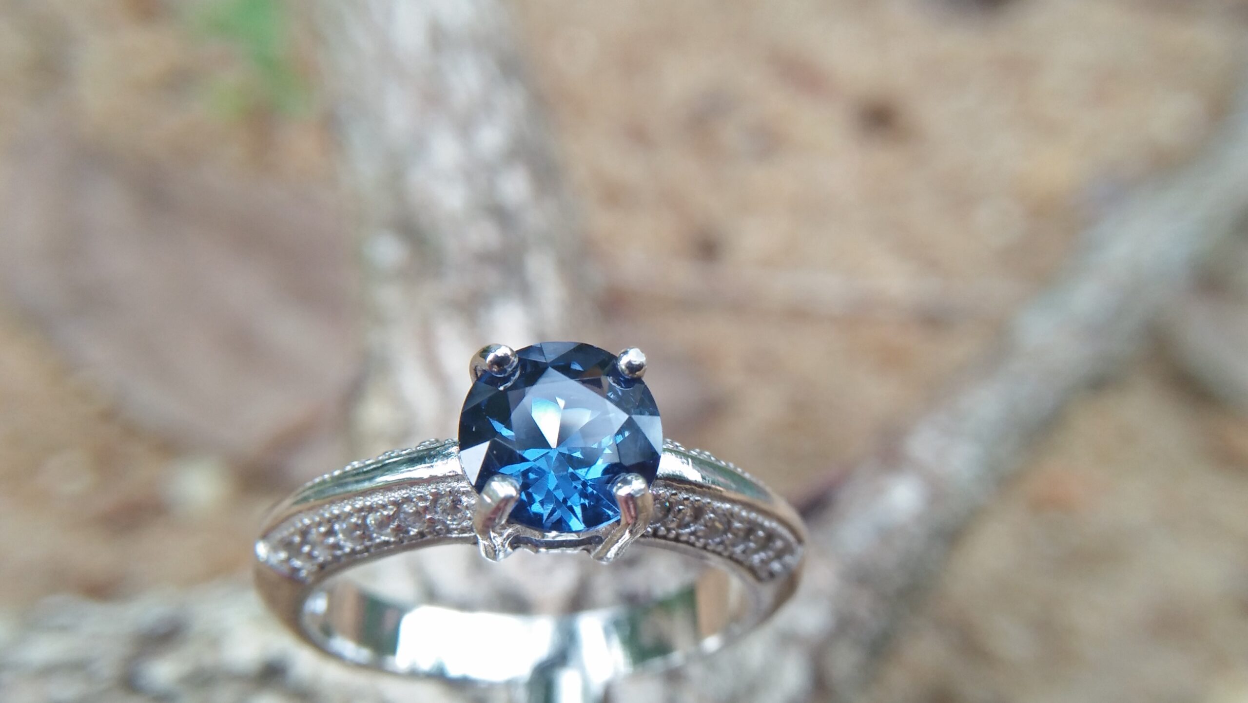 Natural Blue Spinel Standard 925 Silver Ring Stone : Natuarl Blue Sapinel Shape : Round Brilliant Cut ( Diamond Cut) Clarity : Clean Treatment : Natural/Unheated Dimension : 6.1 mm x 3.1mm Mineral : City of gem Ratnapura Sri Lanka Metal : Standard 925 Silver Other : Also, We attached 24 AD's (American Diamond) to get more luster & More Beauty.