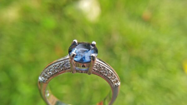 Natural Blue Spinel Standard 925 Silver Ring Stone : Natuarl Blue Sapinel Shape : Round Brilliant Cut ( Diamond Cut) Clarity : Clean Treatment : Natural/Unheated Dimension : 6.1 mm x 3.1mm Mineral : City of gem Ratnapura Sri Lanka Metal : Standard 925 Silver Other : Also, We attached 24 AD's (American Diamond) to get more luster & More Beauty.