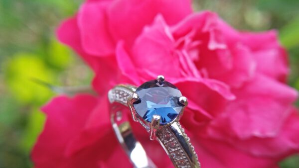 Natural Blue Spinel Standard 925 Silver Ring Stone : Natuarl Blue Sapinel Shape : Round Brilliant Cut ( Diamond Cut) Clarity : Clean Treatment : Natural/Unheated Dimension : 6.1 mm x 3.1mm Mineral : City of gem Ratnapura Sri Lanka Metal : Standard 925 Silver Other : Also, We attached 24 AD's (American Diamond) to get more luster & More Beauty.