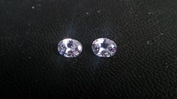 NATURAL Lavender Spinel Pair Shape : Ovel Clarity : SI Treatment : Natural/Unheated Dimension : 6.5mm x 5mm x 3mm ( Both Same) Weight : 1.45Cts (Both) Cut : Flower Cut Dispersion : Good Colour : Light Lavender
