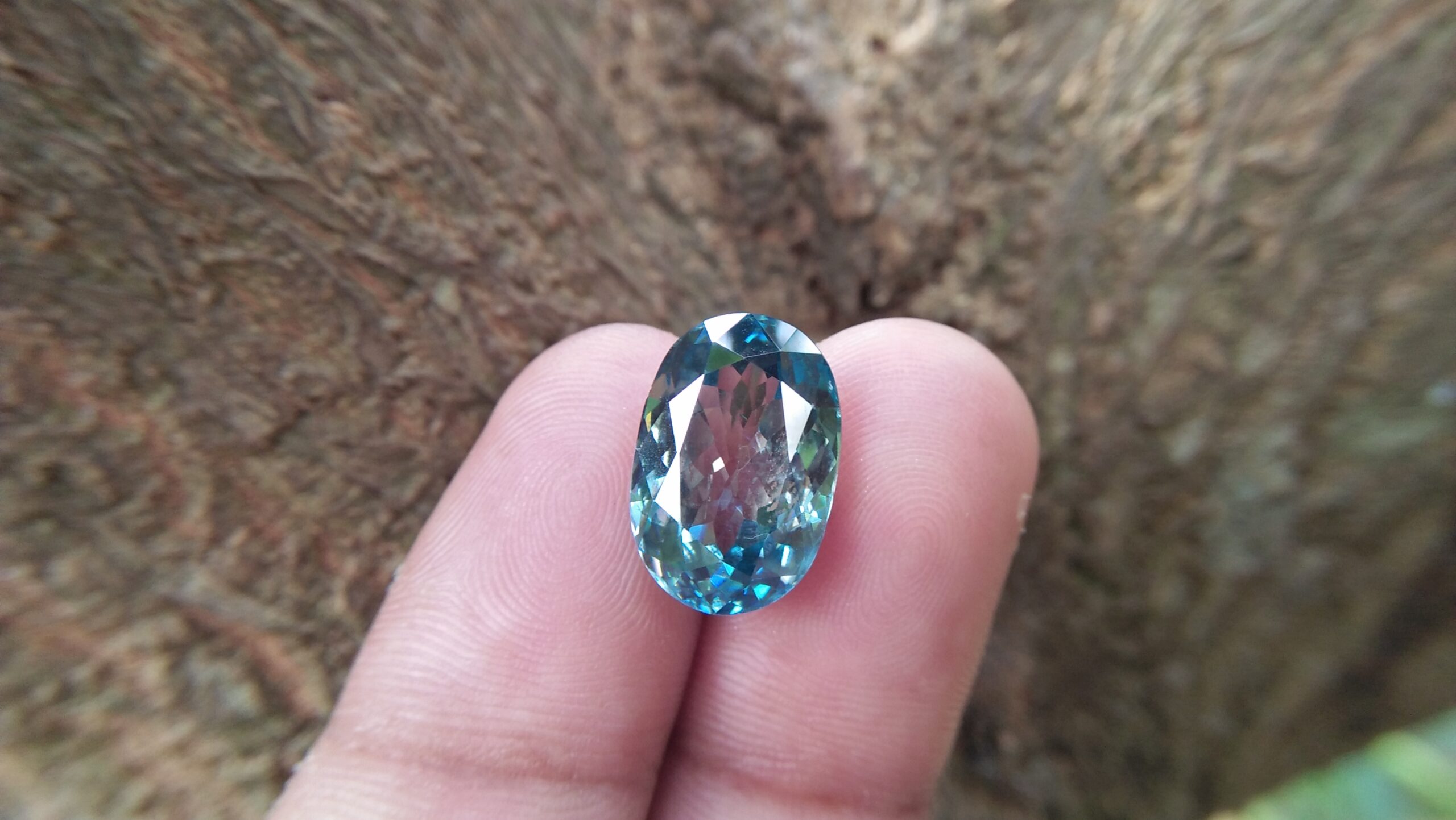 Natural Genuine Blue Zircon - Starlite WEIGHT : 13.03ct COLOUR : Vivid Greenish Blue CUT & SHAPE : Fancy Oval TRANSPARENCY : Transparent MEASUREMMENT : 15.2x 10.35 x 7.21mm SPECREUM : Rare earth spectrum TREATMENT : None "GLK" Certified ( GIA Alumni Association Member/ Member of Gemmological association Great Britain) GLK : UN - 01484 • Blue zircon is one of the US birthstones for December
