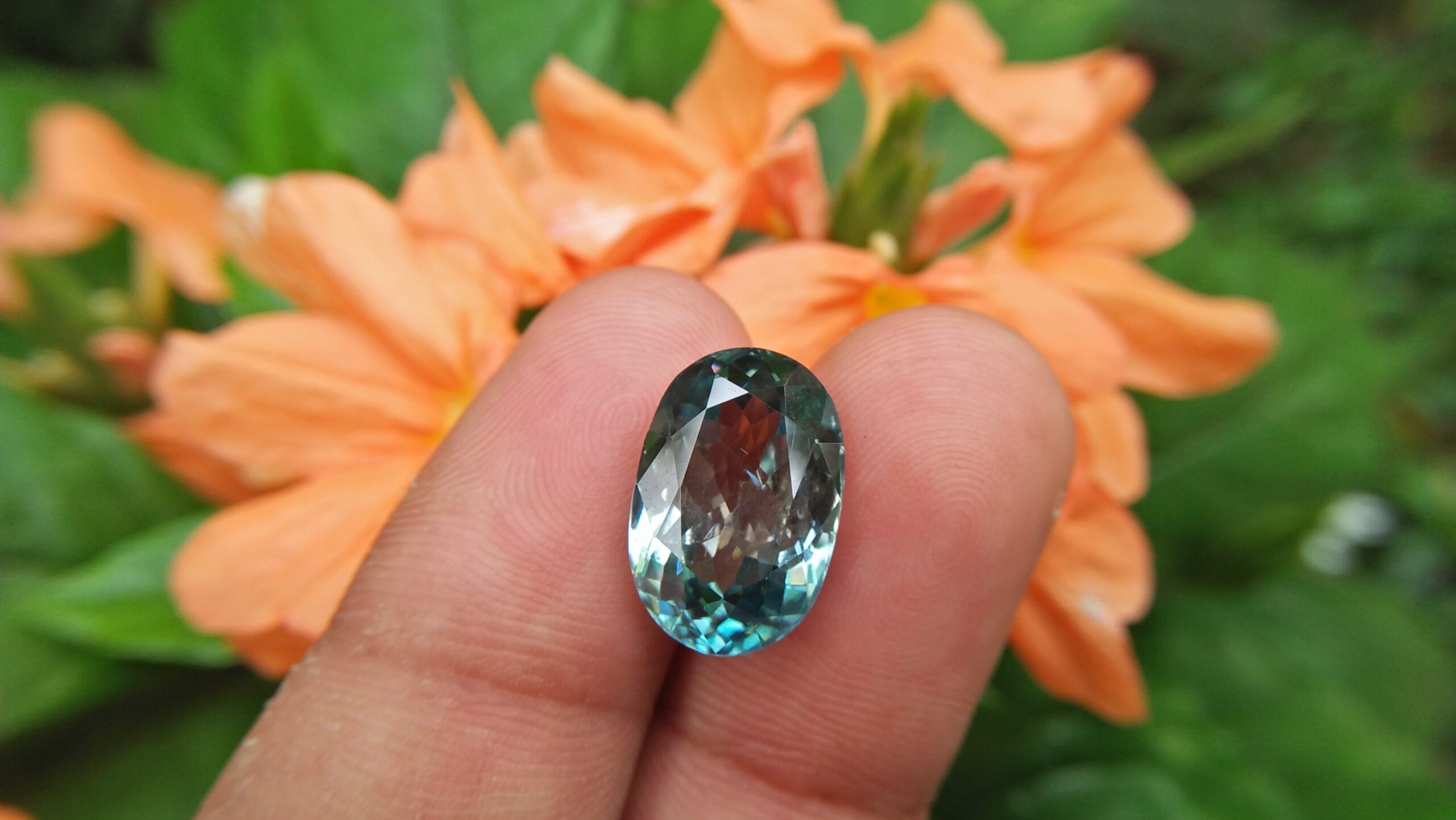 Natural Genuine Blue Zircon - Starlite WEIGHT : 13.03ct COLOUR : Vivid Greenish Blue CUT & SHAPE : Fancy Oval TRANSPARENCY : Transparent MEASUREMMENT : 15.2x 10.35 x 7.21mm SPECREUM : Rare earth spectrum TREATMENT : None "GLK" Certified ( GIA Alumni Association Member/ Member of Gemmological association Great Britain) GLK : UN - 01484 • Blue zircon is one of the US birthstones for December