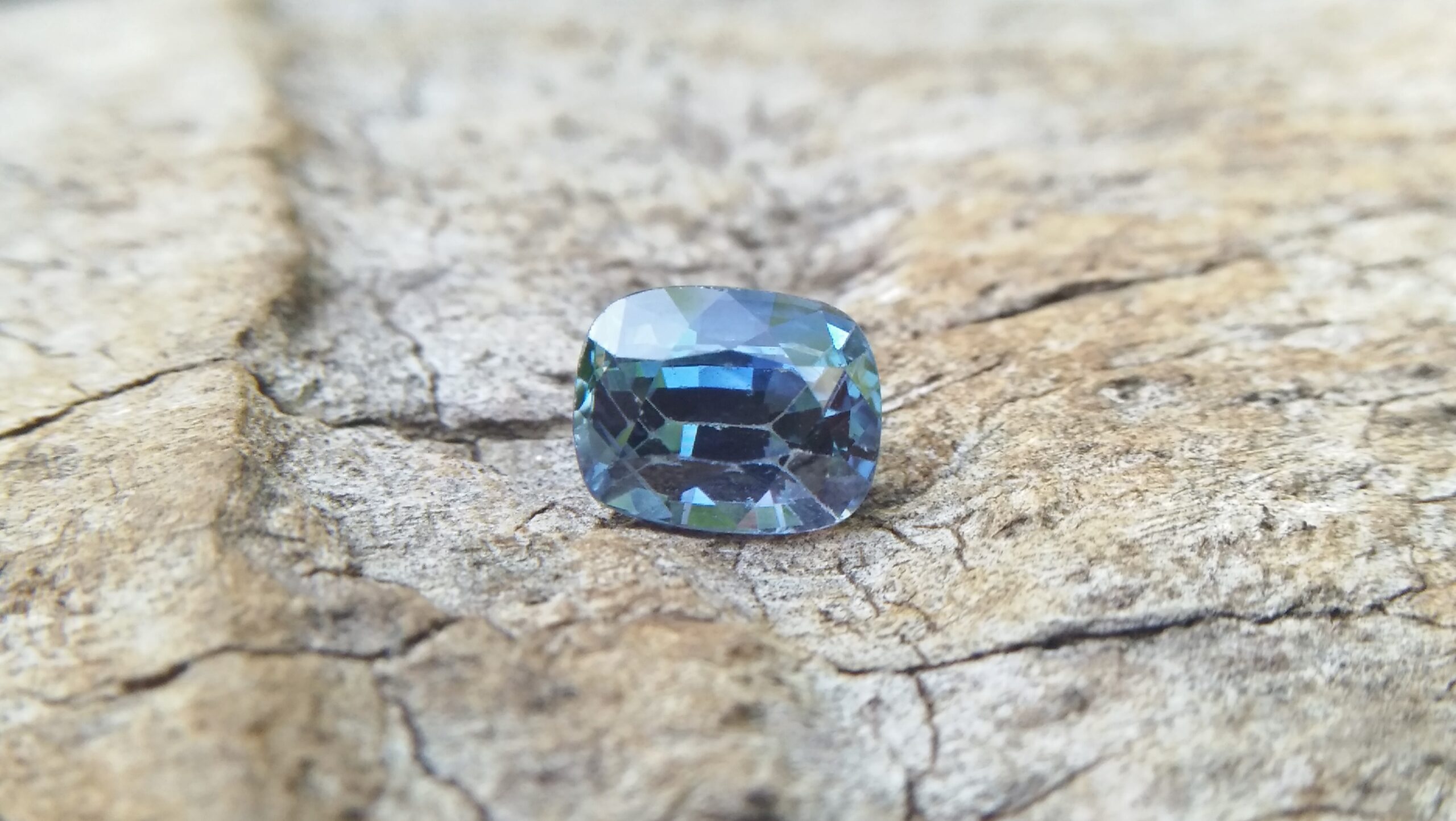 Sapphire is the birthstone for September NATURAL BLUE SAPPHIRE Shape : Cution Cut : Mixed Cut Dimension : 6.8 mmx 5.4 mm x 4.4 mm Weight : 1.50Cts Clarity : VVS Colour : Greenish Blue Transparency : Transparent