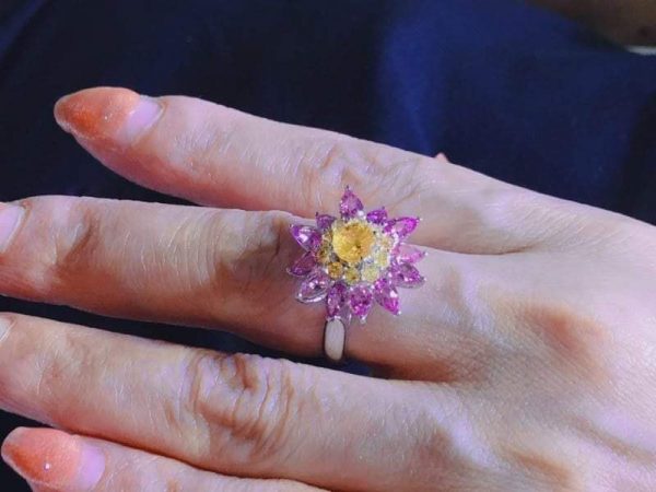 Ceylon Natural Yellow Sapphire & Pink Sapphire Diamond 18K White Gold Flower Ring Main Stone : Ceylon Yellow Sapphire Main Stone Weight : 0.82Cts Other : Small Pink Sapphire & Yellow Sapphire 3.28Cts Metal : 18K White Gold Made from : Japan Weight : 5.2g High Quality Jewellery Made in Japan & Stones from Sri Lanka