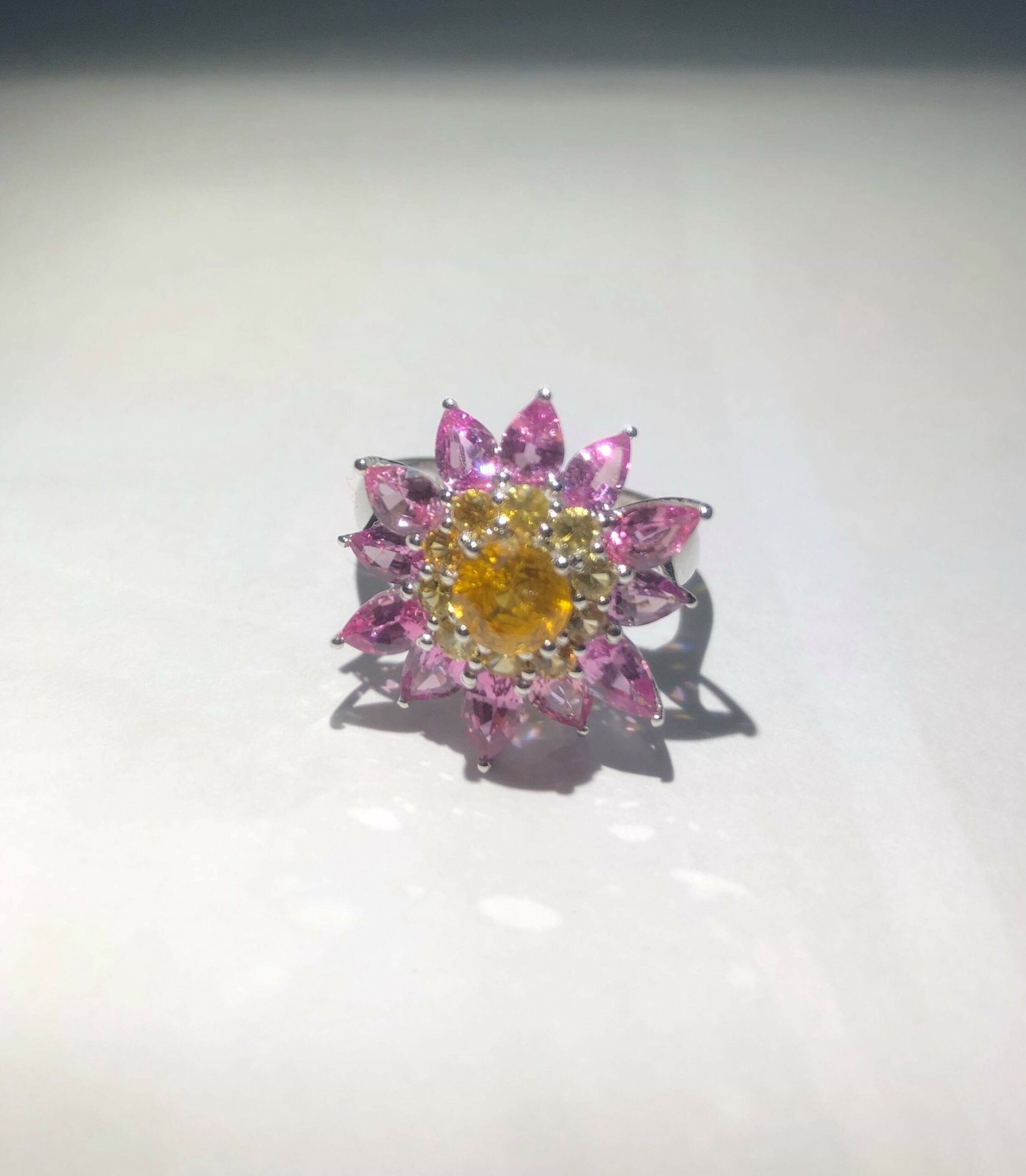 Ceylon Natural Yellow Sapphire & Pink Sapphire Diamond 18K White Gold Flower Ring Main Stone : Ceylon Yellow Sapphire Main Stone Weight : 0.82Cts Other : Small Pink Sapphire & Yellow Sapphire 3.28Cts Metal : 18K White Gold Made from : Japan Weight : 5.2g High Quality Jewellery Made in Japan & Stones from Sri Lanka