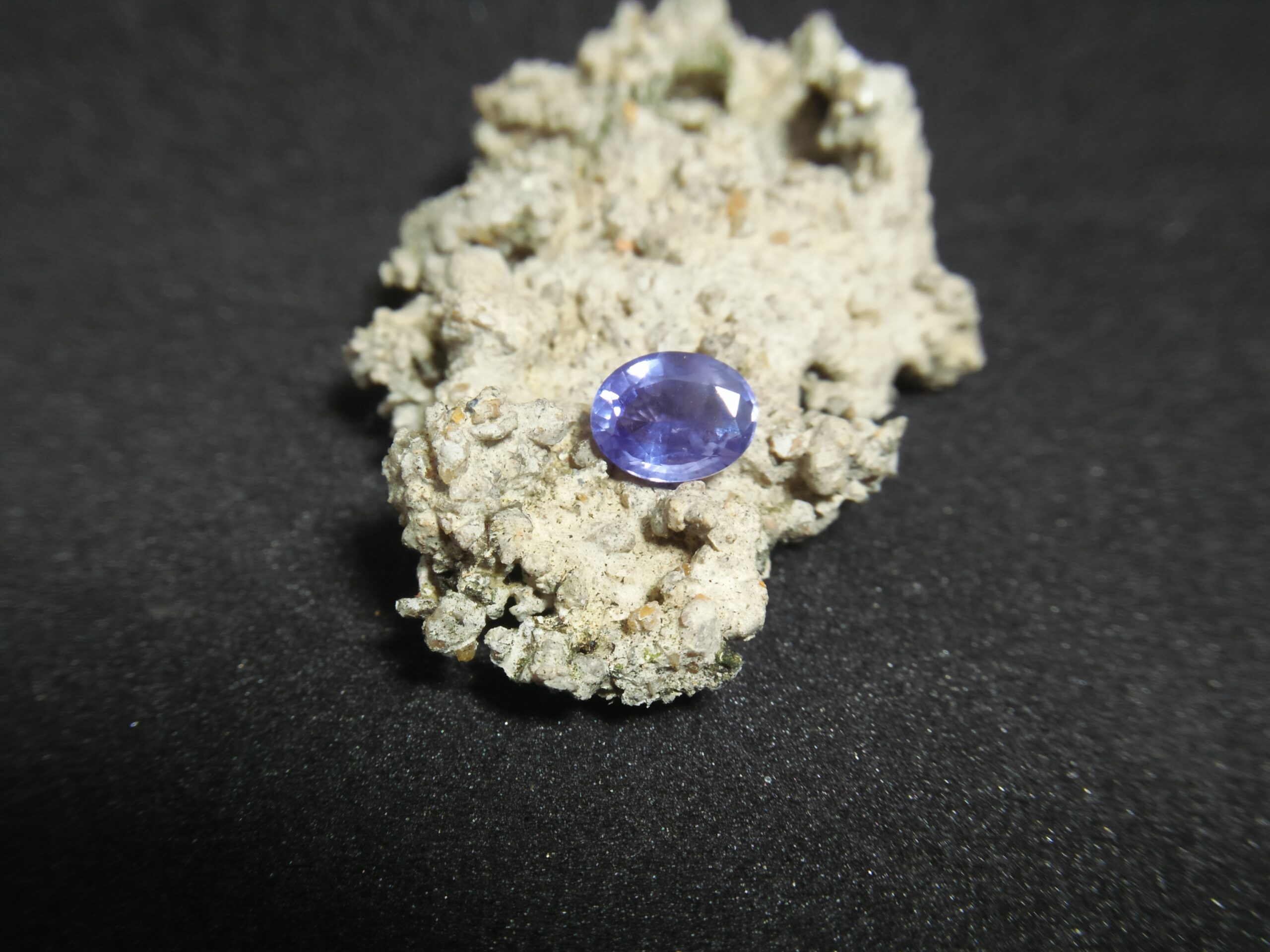 Ceylon Natural Blue Sapphire Colour : Blue Shape : Oval Weight : 1.65 ct Dimension : 7.7mm x 6.2mm x 3.8 mm Treatment : Unheated/ Natural • CSL - Colored Stone Laboratory Certified ( GIA Alumina Association Member ) • CSL Memo No : 6DC22456E105 Sapphire is a precious gemstone, a variety of the mineral corundum, consisting of aluminum oxide with trace amounts of elements such as iron, titanium, chromium, copper, or magnesium. Sapphire deposits are found in Eastern Australia, Thailand, Sri Lanka, China, Vietnam, Madagascar, Greenland, East Africa, and in North America in mostly in Montana. Madagascar, Sri Lanka, and Kashmir produce large quantities of fine quality Sapphires for the world market. Sapphires are mined from alluvial deposits or from primary underground workings. Blue Sapphire and Ruby are the most popular Gemstone in Corundum Family. also, Orangy Pink Sapphire is called Padparadscha. The name Drive's from the Sinhalese word "padmaraga" " පද්මරාග", meaning lotus blossom, as the stone is of a similar color to the lotus blossom. Bi-Color Sapphire from DanuGroup Collection Also, Sapphire can be found as parti-color, bi-color or fancy color. Australia is a main parti-color Sapphire producer. White Sapphire also, White sapphire is a very popular stone to wear instead of Diamond as a 3rd hardness gemstone after diamond ( moissanite hardness is 9.5). Various colors of star sapphires A star sapphire is a type of sapphire that exhibits a star-like phenomenon known as asterism. Also, A rare variety of natural sapphire, known as color-change sapphire, exhibits different colors in a different light. Sapphires can be treated by several methods to enhance and improve their clarity and color. A common method is done by heating the sapphires in furnaces to temperatures between 500 and 1,850 °C for several hours, or by heating in a nitrogen-deficient atmosphere oven for 1 week or more. Geuda is a form of the mineral corundum. Geuda is found primarily in Sri Lanka. It's a semitransparent and milky appearance due to rutile inclusions. Geuda is used to improve its color by heat treatment. Some geuda varieties turn to a blue color after heat treatments and some turn to red after oxidizing. Also, Kowangu pushparaga turns to yellow sapphire after oxidizing. Sapphire Crystal system is a Trigonal crystal system with a hexagonal scalenohedral crystal class. Sapphire hardness is 9 according to the Mohs hardness scale with 4.0~4.1 specific gravity. Refractive index ω =1.768–1.772 nε =1.760–1.763 Solubility = Insoluble Melting point = 2,030–2,050 °C Birefringence = 0.008 Pleochroism = Strong Luster = Vitreous Sapphire is the birthstone for September and the gem of the 45th anniversary. Healing Properties of Sapphire Sapphire releases mental tension, depression, unwanted thoughts, and spiritual confusion. Sapphire is known as a "stone of Wisdom". It is exceptional for calming and focusing the mind, allowing the release of mental tension and unwanted thoughts. Sapphire is also the best stone for awakening chakras. Dark Blue or Indigo Sapphire stimulates the Third Eye chakra. Blue Sapphire stimulates the Throat Chakra. Green sapphire stimulates Heart Chakra. Black Sapphire stimulates Base Chakra. White sapphire stimulates Crown Chakra. Yellow sapphire stimulates Solar Plexus Chakra. Blue Sapphire stimulates the Throat Chakra and Third eye chakra, the voice of the body. Blue crystal energy will unblock and balance the Throat Chakra. blue encourages the power of truth, while lighter shades carry the power of flexibility, relaxation, and balance. Blue Sapphire can free one of mental anxiety, helps make one detached, and protects against envy. Also, It can be worn for good luck and for protection against evil spirits. Since Saturn rules the nervous system, blue sapphires help problems of the nerves-tension and neuroses-diseases caused by an afflicted Saturn.