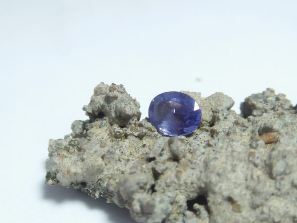 Ceylon Natural Blue Sapphire Colour : Blue Shape : Oval Weight : 1.65 ct Dimension : 7.7mm x 6.2mm x 3.8 mm Treatment : Unheated/ Natural • CSL - Colored Stone Laboratory Certified ( GIA Alumina Association Member ) • CSL Memo No : 6DC22456E105 Sapphire is a precious gemstone, a variety of the mineral corundum, consisting of aluminum oxide with trace amounts of elements such as iron, titanium, chromium, copper, or magnesium. Sapphire deposits are found in Eastern Australia, Thailand, Sri Lanka, China, Vietnam, Madagascar, Greenland, East Africa, and in North America in mostly in Montana. Madagascar, Sri Lanka, and Kashmir produce large quantities of fine quality Sapphires for the world market. Sapphires are mined from alluvial deposits or from primary underground workings. Blue Sapphire and Ruby are the most popular Gemstone in Corundum Family. also, Orangy Pink Sapphire is called Padparadscha. The name Drive's from the Sinhalese word "padmaraga" " පද්මරාග", meaning lotus blossom, as the stone is of a similar color to the lotus blossom. Bi-Color Sapphire from DanuGroup Collection Also, Sapphire can be found as parti-color, bi-color or fancy color. Australia is a main parti-color Sapphire producer. White Sapphire also, White sapphire is a very popular stone to wear instead of Diamond as a 3rd hardness gemstone after diamond ( moissanite hardness is 9.5). Various colors of star sapphires A star sapphire is a type of sapphire that exhibits a star-like phenomenon known as asterism. Also, A rare variety of natural sapphire, known as color-change sapphire, exhibits different colors in a different light. Sapphires can be treated by several methods to enhance and improve their clarity and color. A common method is done by heating the sapphires in furnaces to temperatures between 500 and 1,850 °C for several hours, or by heating in a nitrogen-deficient atmosphere oven for 1 week or more. Geuda is a form of the mineral corundum. Geuda is found primarily in Sri Lanka. It's a semitransparent and milky appearance due to rutile inclusions. Geuda is used to improve its color by heat treatment. Some geuda varieties turn to a blue color after heat treatments and some turn to red after oxidizing. Also, Kowangu pushparaga turns to yellow sapphire after oxidizing. Sapphire Crystal system is a Trigonal crystal system with a hexagonal scalenohedral crystal class. Sapphire hardness is 9 according to the Mohs hardness scale with 4.0~4.1 specific gravity. Refractive index ω          =1.768–1.772 nε =1.760–1.763 Solubility = Insoluble Melting point = 2,030–2,050 °C Birefringence  = 0.008 Pleochroism = Strong Luster = Vitreous Sapphire is the birthstone for September and the gem of the 45th anniversary. Healing Properties of Sapphire Sapphire releases mental tension, depression, unwanted thoughts, and spiritual confusion.  Sapphire is known as a "stone of Wisdom". It is exceptional for calming and focusing the mind, allowing the release of mental tension and unwanted thoughts. Sapphire is also the best stone for awakening chakras. Dark Blue or Indigo Sapphire stimulates the Third Eye chakra. Blue Sapphire stimulates the Throat Chakra. Green sapphire stimulates Heart Chakra. Black Sapphire stimulates Base Chakra. White sapphire stimulates Crown Chakra. Yellow sapphire stimulates Solar Plexus Chakra. Blue Sapphire stimulates the Throat Chakra and Third eye chakra, the voice of the body. Blue crystal energy will unblock and balance the Throat Chakra. blue encourages the power of truth, while lighter shades carry the power of flexibility, relaxation, and balance. Blue Sapphire can free one of mental anxiety, helps make one detached, and protects against envy. Also, It can be worn for good luck and for protection against evil spirits. Since Saturn rules the nervous system, blue sapphires help problems of the nerves-tension and neuroses-diseases caused by an afflicted Saturn.