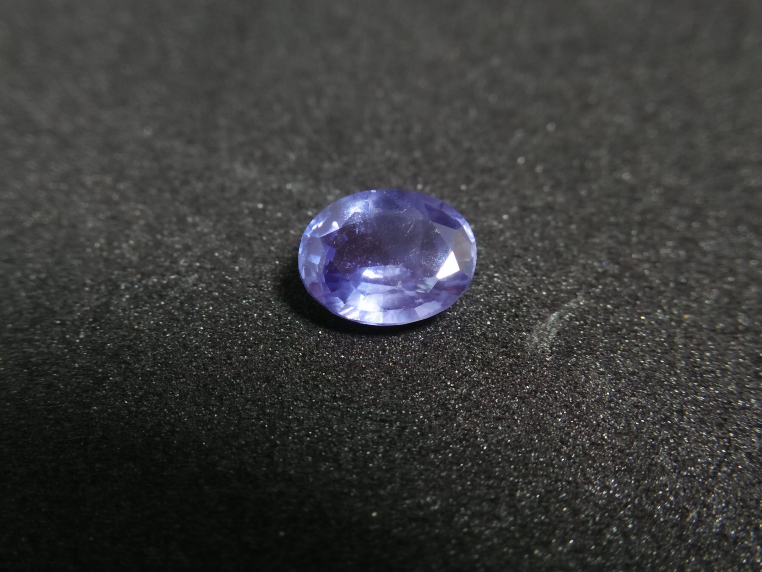 Ceylon Natural Blue Sapphire Colour : Blue Shape : Oval Weight : 1.65 ct Dimension : 7.7mm x 6.2mm x 3.8 mm Treatment : Unheated/ Natural • CSL - Colored Stone Laboratory Certified ( GIA Alumina Association Member ) • CSL Memo No : 6DC22456E105 Sapphire is a precious gemstone, a variety of the mineral corundum, consisting of aluminum oxide with trace amounts of elements such as iron, titanium, chromium, copper, or magnesium. Sapphire deposits are found in Eastern Australia, Thailand, Sri Lanka, China, Vietnam, Madagascar, Greenland, East Africa, and in North America in mostly in Montana. Madagascar, Sri Lanka, and Kashmir produce large quantities of fine quality Sapphires for the world market. Sapphires are mined from alluvial deposits or from primary underground workings. Blue Sapphire and Ruby are the most popular Gemstone in Corundum Family. also, Orangy Pink Sapphire is called Padparadscha. The name Drive's from the Sinhalese word "padmaraga" " පද්මරාග", meaning lotus blossom, as the stone is of a similar color to the lotus blossom. Bi-Color Sapphire from DanuGroup Collection Also, Sapphire can be found as parti-color, bi-color or fancy color. Australia is a main parti-color Sapphire producer. White Sapphire also, White sapphire is a very popular stone to wear instead of Diamond as a 3rd hardness gemstone after diamond ( moissanite hardness is 9.5). Various colors of star sapphires A star sapphire is a type of sapphire that exhibits a star-like phenomenon known as asterism. Also, A rare variety of natural sapphire, known as color-change sapphire, exhibits different colors in a different light. Sapphires can be treated by several methods to enhance and improve their clarity and color. A common method is done by heating the sapphires in furnaces to temperatures between 500 and 1,850 °C for several hours, or by heating in a nitrogen-deficient atmosphere oven for 1 week or more. Geuda is a form of the mineral corundum. Geuda is found primarily in Sri Lanka. It's a semitransparent and milky appearance due to rutile inclusions. Geuda is used to improve its color by heat treatment. Some geuda varieties turn to a blue color after heat treatments and some turn to red after oxidizing. Also, Kowangu pushparaga turns to yellow sapphire after oxidizing. Sapphire Crystal system is a Trigonal crystal system with a hexagonal scalenohedral crystal class. Sapphire hardness is 9 according to the Mohs hardness scale with 4.0~4.1 specific gravity. Refractive index ω =1.768–1.772 nε =1.760–1.763 Solubility = Insoluble Melting point = 2,030–2,050 °C Birefringence = 0.008 Pleochroism = Strong Luster = Vitreous Sapphire is the birthstone for September and the gem of the 45th anniversary. Healing Properties of Sapphire Sapphire releases mental tension, depression, unwanted thoughts, and spiritual confusion. Sapphire is known as a "stone of Wisdom". It is exceptional for calming and focusing the mind, allowing the release of mental tension and unwanted thoughts. Sapphire is also the best stone for awakening chakras. Dark Blue or Indigo Sapphire stimulates the Third Eye chakra. Blue Sapphire stimulates the Throat Chakra. Green sapphire stimulates Heart Chakra. Black Sapphire stimulates Base Chakra. White sapphire stimulates Crown Chakra. Yellow sapphire stimulates Solar Plexus Chakra. Blue Sapphire stimulates the Throat Chakra and Third eye chakra, the voice of the body. Blue crystal energy will unblock and balance the Throat Chakra. blue encourages the power of truth, while lighter shades carry the power of flexibility, relaxation, and balance. Blue Sapphire can free one of mental anxiety, helps make one detached, and protects against envy. Also, It can be worn for good luck and for protection against evil spirits. Since Saturn rules the nervous system, blue sapphires help problems of the nerves-tension and neuroses-diseases caused by an afflicted Saturn.