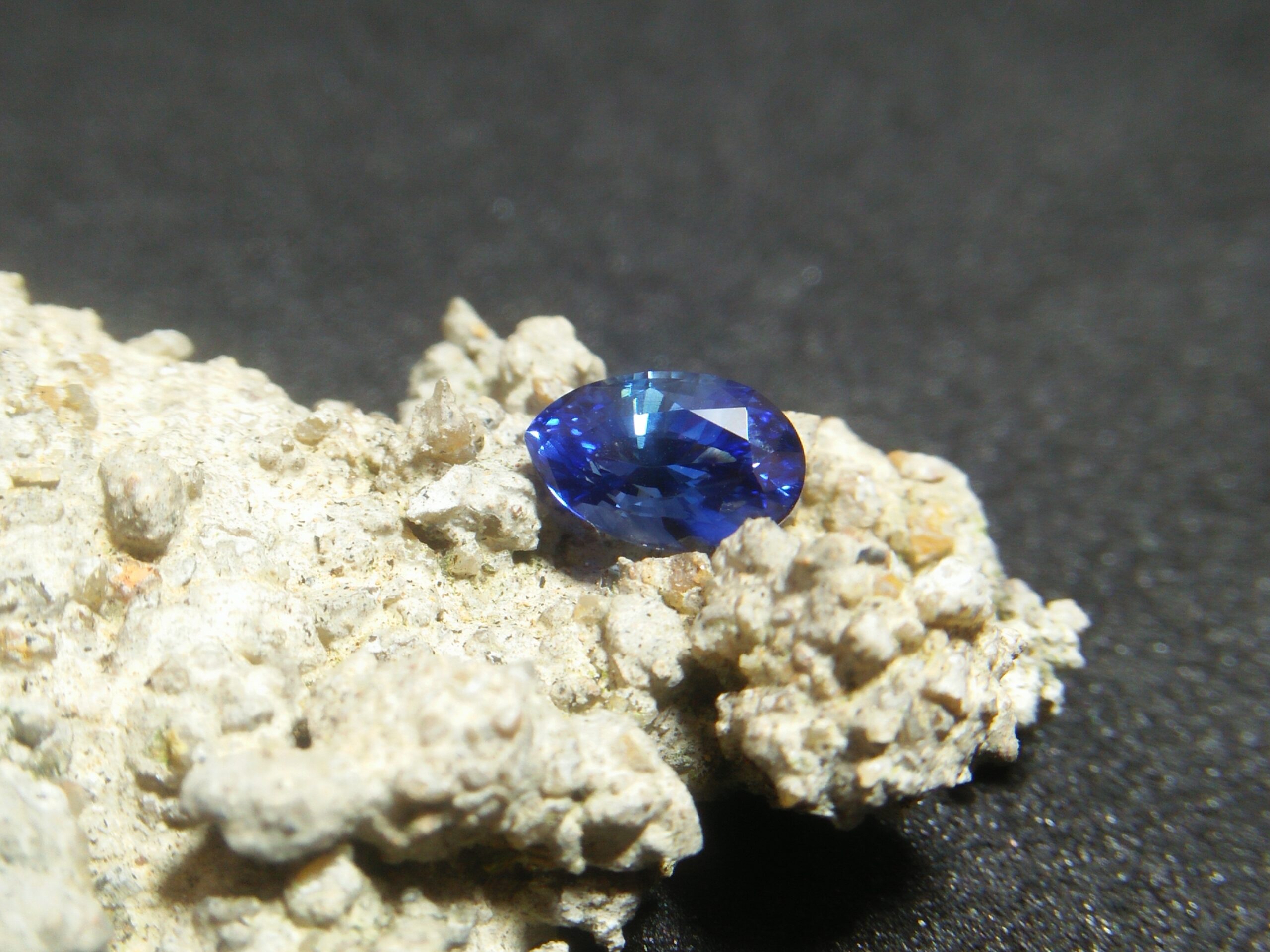 Ceylon Natural Blue Sapphire Colour : Vivid Blue "Royal Blue" Shape : Pear Weight : 1.39Cts Dimension : 8.1mm x 5.3mm x 4.3mm Treatment : Heated Clarity : VS • CSL - Colored Stone Laboratory Certified ( GIA Alumina Association Member ) • CSL Memo No : 4524B473EC71 Sapphire is a precious gemstone, a variety of the mineral corundum, consisting of aluminum oxide with trace amounts of elements such as iron, titanium, chromium, copper, or magnesium. Sapphire deposits are found in Eastern Australia, Thailand, Sri Lanka, China, Vietnam, Madagascar, Greenland, East Africa, and in North America in mostly in Montana. Madagascar, Sri Lanka, and Kashmir produce large quantities of fine quality Sapphires for the world market. Sapphires are mined from alluvial deposits or from primary underground workings. Blue Sapphire and Ruby are the most popular Gemstone in Corundum Family. also, Orangy Pink Sapphire is called Padparadscha. The name Drive's from the Sinhalese word "padmaraga" " පද්මරාග", meaning lotus blossom, as the stone is of a similar color to the lotus blossom. Bi-Color Sapphire from DanuGroup Collection Also, Sapphire can be found as parti-color, bi-color or fancy color. Australia is a main parti-color Sapphire producer. White Sapphire also, White sapphire is a very popular stone to wear instead of Diamond as a 3rd hardness gemstone after diamond ( moissanite hardness is 9.5). Various colors of star sapphires A star sapphire is a type of sapphire that exhibits a star-like phenomenon known as asterism. Also, A rare variety of natural sapphire, known as color-change sapphire, exhibits different colors in a different light. Sapphires can be treated by several methods to enhance and improve their clarity and color. A common method is done by heating the sapphires in furnaces to temperatures between 500 and 1,850 °C for several hours, or by heating in a nitrogen-deficient atmosphere oven for 1 week or more. Geuda is a form of the mineral corundum. Geuda is found primarily in Sri Lanka. It's a semitransparent and milky appearance due to rutile inclusions. Geuda is used to improve its color by heat treatment. Some geuda varieties turn to a blue color after heat treatments and some turn to red after oxidizing. Also, Kowangu pushparaga turns to yellow sapphire after oxidizing. Sapphire Crystal system is a Trigonal crystal system with a hexagonal scalenohedral crystal class. Sapphire hardness is 9 according to the Mohs hardness scale with 4.0~4.1 specific gravity. Refractive index ω =1.768–1.772 nε =1.760–1.763 Solubility = Insoluble Melting point = 2,030–2,050 °C Birefringence = 0.008 Pleochroism = Strong Luster = Vitreous Sapphire is the birthstone for September and the gem of the 45th anniversary. Healing Properties of Sapphire Sapphire releases mental tension, depression, unwanted thoughts, and spiritual confusion. Sapphire is known as a "stone of Wisdom". It is exceptional for calming and focusing the mind, allowing the release of mental tension and unwanted thoughts. Sapphire is also the best stone for awakening chakras. Dark Blue or Indigo Sapphire stimulates the Third Eye chakra. Blue Sapphire stimulates the Throat Chakra. Green sapphire stimulates Heart Chakra. Black Sapphire stimulates Base Chakra. White sapphire stimulates Crown Chakra. Yellow sapphire stimulates Solar Plexus Chakra. Blue Sapphire stimulates the Throat Chakra and Third eye chakra, the voice of the body. Blue crystal energy will unblock and balance the Throat Chakra. blue encourages the power of truth, while lighter shades carry the power of flexibility, relaxation, and balance. Blue Sapphire can free one of mental anxiety, helps make one detached, and protects against envy. Also, It can be worn for good luck and for protection against evil spirits. Since Saturn rules the nervous system, blue sapphires help problems of the nerves-tension and neuroses-diseases caused by an afflicted Saturn.