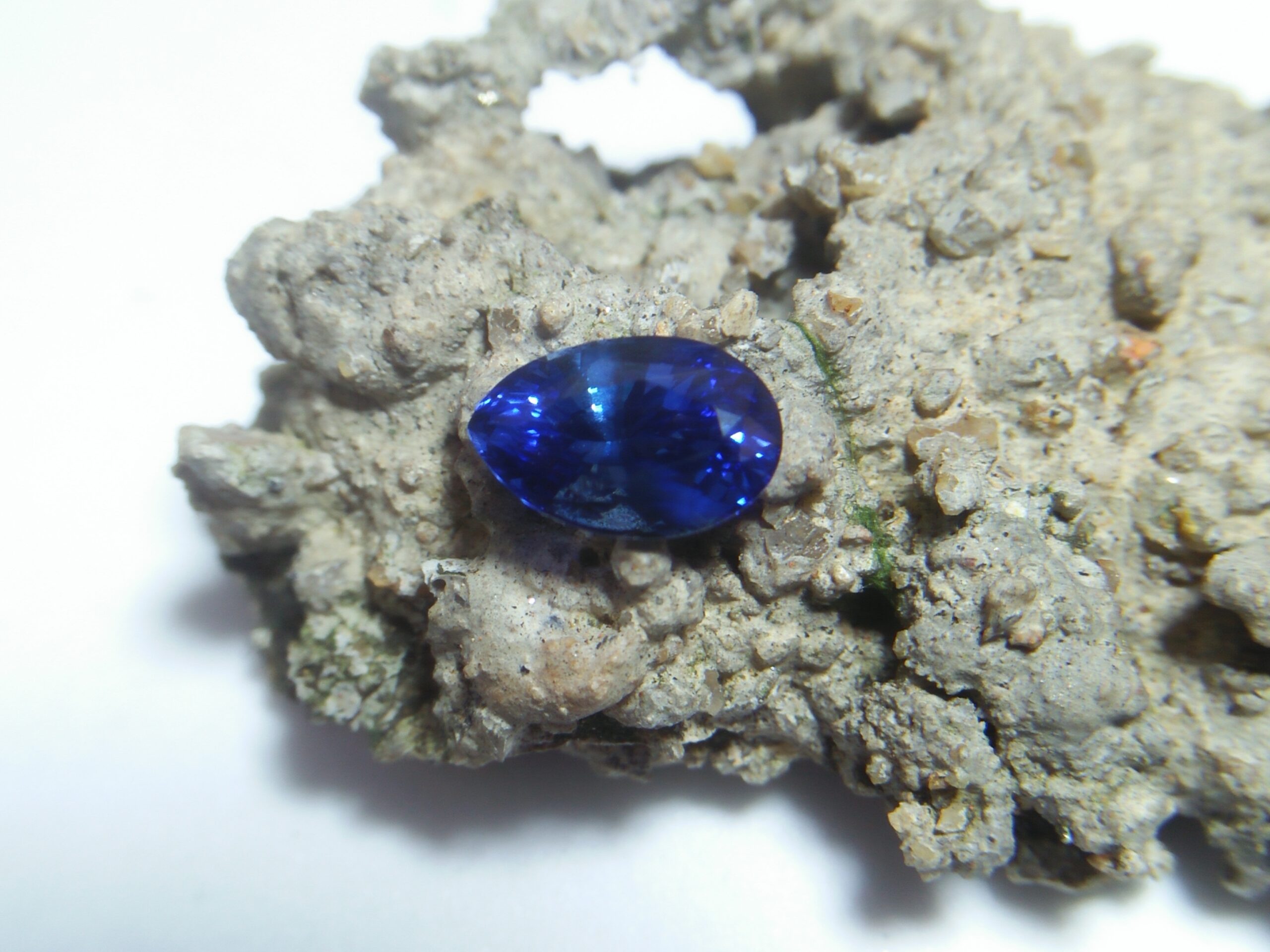 Ceylon Natural Blue Sapphire Colour : Vivid Blue "Royal Blue" Shape : Pear Weight : 1.39Cts Dimension : 8.1mm x 5.3mm x 4.3mm Treatment : Heated Clarity : VS • CSL - Colored Stone Laboratory Certified ( GIA Alumina Association Member ) • CSL Memo No : 4524B473EC71 Sapphire is a precious gemstone, a variety of the mineral corundum, consisting of aluminum oxide with trace amounts of elements such as iron, titanium, chromium, copper, or magnesium. Sapphire deposits are found in Eastern Australia, Thailand, Sri Lanka, China, Vietnam, Madagascar, Greenland, East Africa, and in North America in mostly in Montana. Madagascar, Sri Lanka, and Kashmir produce large quantities of fine quality Sapphires for the world market. Sapphires are mined from alluvial deposits or from primary underground workings. Blue Sapphire and Ruby are the most popular Gemstone in Corundum Family. also, Orangy Pink Sapphire is called Padparadscha. The name Drive's from the Sinhalese word "padmaraga" " පද්මරාග", meaning lotus blossom, as the stone is of a similar color to the lotus blossom. Bi-Color Sapphire from DanuGroup Collection Also, Sapphire can be found as parti-color, bi-color or fancy color. Australia is a main parti-color Sapphire producer. White Sapphire also, White sapphire is a very popular stone to wear instead of Diamond as a 3rd hardness gemstone after diamond ( moissanite hardness is 9.5). Various colors of star sapphires A star sapphire is a type of sapphire that exhibits a star-like phenomenon known as asterism. Also, A rare variety of natural sapphire, known as color-change sapphire, exhibits different colors in a different light. Sapphires can be treated by several methods to enhance and improve their clarity and color. A common method is done by heating the sapphires in furnaces to temperatures between 500 and 1,850 °C for several hours, or by heating in a nitrogen-deficient atmosphere oven for 1 week or more. Geuda is a form of the mineral corundum. Geuda is found primarily in Sri Lanka. It's a semitransparent and milky appearance due to rutile inclusions. Geuda is used to improve its color by heat treatment. Some geuda varieties turn to a blue color after heat treatments and some turn to red after oxidizing. Also, Kowangu pushparaga turns to yellow sapphire after oxidizing. Sapphire Crystal system is a Trigonal crystal system with a hexagonal scalenohedral crystal class. Sapphire hardness is 9 according to the Mohs hardness scale with 4.0~4.1 specific gravity. Refractive index ω =1.768–1.772 nε =1.760–1.763 Solubility = Insoluble Melting point = 2,030–2,050 °C Birefringence = 0.008 Pleochroism = Strong Luster = Vitreous Sapphire is the birthstone for September and the gem of the 45th anniversary. Healing Properties of Sapphire Sapphire releases mental tension, depression, unwanted thoughts, and spiritual confusion. Sapphire is known as a "stone of Wisdom". It is exceptional for calming and focusing the mind, allowing the release of mental tension and unwanted thoughts. Sapphire is also the best stone for awakening chakras. Dark Blue or Indigo Sapphire stimulates the Third Eye chakra. Blue Sapphire stimulates the Throat Chakra. Green sapphire stimulates Heart Chakra. Black Sapphire stimulates Base Chakra. White sapphire stimulates Crown Chakra. Yellow sapphire stimulates Solar Plexus Chakra. Blue Sapphire stimulates the Throat Chakra and Third eye chakra, the voice of the body. Blue crystal energy will unblock and balance the Throat Chakra. blue encourages the power of truth, while lighter shades carry the power of flexibility, relaxation, and balance. Blue Sapphire can free one of mental anxiety, helps make one detached, and protects against envy. Also, It can be worn for good luck and for protection against evil spirits. Since Saturn rules the nervous system, blue sapphires help problems of the nerves-tension and neuroses-diseases caused by an afflicted Saturn.