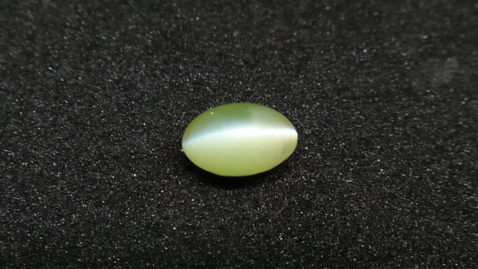 Chrysoberyl Cats Eye Colour : Greenish Yellow Shape : Oval Cut : Cabochon Weight : 1.04 Cts Dimension : 6.5 x 4.1 x 4.1 mm Treatment : Unheated Clarity : Clean • CSL - Colored Stone Laboratory Certified ( GIA Alumina Association Member ) • CSL Memo No : 96FCB5F4103D V The Gemstone Chrysoberyl is an aluminate of beryllium with the chemical formula BeAl₂O₄. The name chrysoberyl is derived from the Greek words "chrysos" and "beryllos". Its meaning is "a gold-white spar". It is known as a hard and durable gem after Sapphire. Chrysoberyl is an orthorhombic crystal mineral with 3.5 – 3.84 specific gravity and 8.5 hardness according to the more hardness scale. It is a Biaxial (+) mineral with refractive indexes nα=1.745 nβ=1.748 nγ=1.754. Chrysoberyl family Gemstones from old collection Chrysoberyl can be found colors such as green, yellow, brownish to greenish-black, colorless, pale shades of yellow, greenish Yellow, Yellowish Green, Honey Brown, Reddish Brown, Orangy yellow, Greenish Brown, Blue. Also, Golden Yellow Chrysoberyl is called "Ceylonese Chrysolite" as a trading name. Alexandrite Alexandrite cats eye The Chrysoberyl Alexandrite is a color change variety upon the nature of ambient lighting. It changes the color green to brownish red or green to purplish-red in the incandescent light from a lamp or candle flame. However, Alexandrite's good color change stones are extremely rare. also, Chrysoberyl alexandrite can be found with a chatoyancy future. It is rare and expensive. Chrysoberyl crystal from Danu Group Old Collection An interesting feature of its crystals are the cyclic twins called trillings. Alexandrite Crystal Under UV Also, Chrysoberyl can be found with the chatoyancy feature. Translucent yellowish chatoyant chrysoberyl is called as cymophane. Also, Chrysoberyl cat's eye is found in colors such as yellowish-green, green, honey brown, grey. The chrysoberyl gemstone or mineral can be found in Sri Lanka, Afghanistan, India, Madagascar, Tanzania, Ethiopia, Australia, Brazil, Canada, France, Germany, Italy, Japan, Kenya, Kazakhstan, Namibia, Myanmar, Mozambique, Norway, Russia, Spain, USA, Zambia. Healing Properties of Chrysoberyls Chrysoberyl is known as an effective and protective stone since ancient times. It transforms negative thoughts into positive energy. Chrysoberyl gemstone or mineral is associated with wealth and creativity and promotes tolerance and harmony. It stimulates the solar plexus and crown chakras. Chrysoberyl helps to open the crown chakra and increases both spiritual and personal power. Green chrysoberyl stimulates the healing of the physical heart. Chrysoberyl stimulates the cleansing and balancing of the liver, kidneys, gall bladder and balances adrenaline and cholesterol and fortifies the chest and liver. Chrysoberyl Cat's eye increases the vibration of Ketu in the wearer according to Vedic Astrology. It is known to reduce the malefic effects of 'Ketu' and increase its beneficial qualities. Chrysoberyl transforms negative thoughts into positive energy. It supports self-healing. Chrysoberyl balances adrenaline and cholesterol and fortifies the chest and liver.