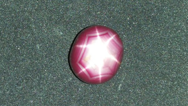 Ceylon Natural Star Ruby A star sapphire is a type of sapphire that exhibits a star-like phenomenon known as asterism. Star sapphires contain intersecting needle-like inclusions following the underlyingcrystal structure that causes the appearance of a six-rayed "star"-shaped pattern when viewed with a single overhead light source. Healing Properties Sapphire helps the user stay on the Spiritual Path, boosting psychic and spiritual powers, and is a great stone for Earth and Chakra healing. also, all corundums share some energies in common, the various colours of Sapphire have individual vibrational signatures and different spiritual properties. Sapphire was used by the Etruscans over 2,500 years ago and was also prized in ancient Rome, Greece and Egypt. Revered as a stone of royalty, sapphire was believed to keep kings safe from harm or envy.