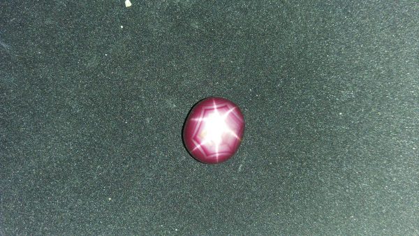 Ceylon Natural Star Ruby A star sapphire is a type of sapphire that exhibits a star-like phenomenon known as asterism. Star sapphires contain intersecting needle-like inclusions following the underlyingcrystal structure that causes the appearance of a six-rayed "star"-shaped pattern when viewed with a single overhead light source. Healing Properties Sapphire helps the user stay on the Spiritual Path, boosting psychic and spiritual powers, and is a great stone for Earth and Chakra healing. also, all corundums share some energies in common, the various colours of Sapphire have individual vibrational signatures and different spiritual properties. Sapphire was used by the Etruscans over 2,500 years ago and was also prized in ancient Rome, Greece and Egypt. Revered as a stone of royalty, sapphire was believed to keep kings safe from harm or envy.